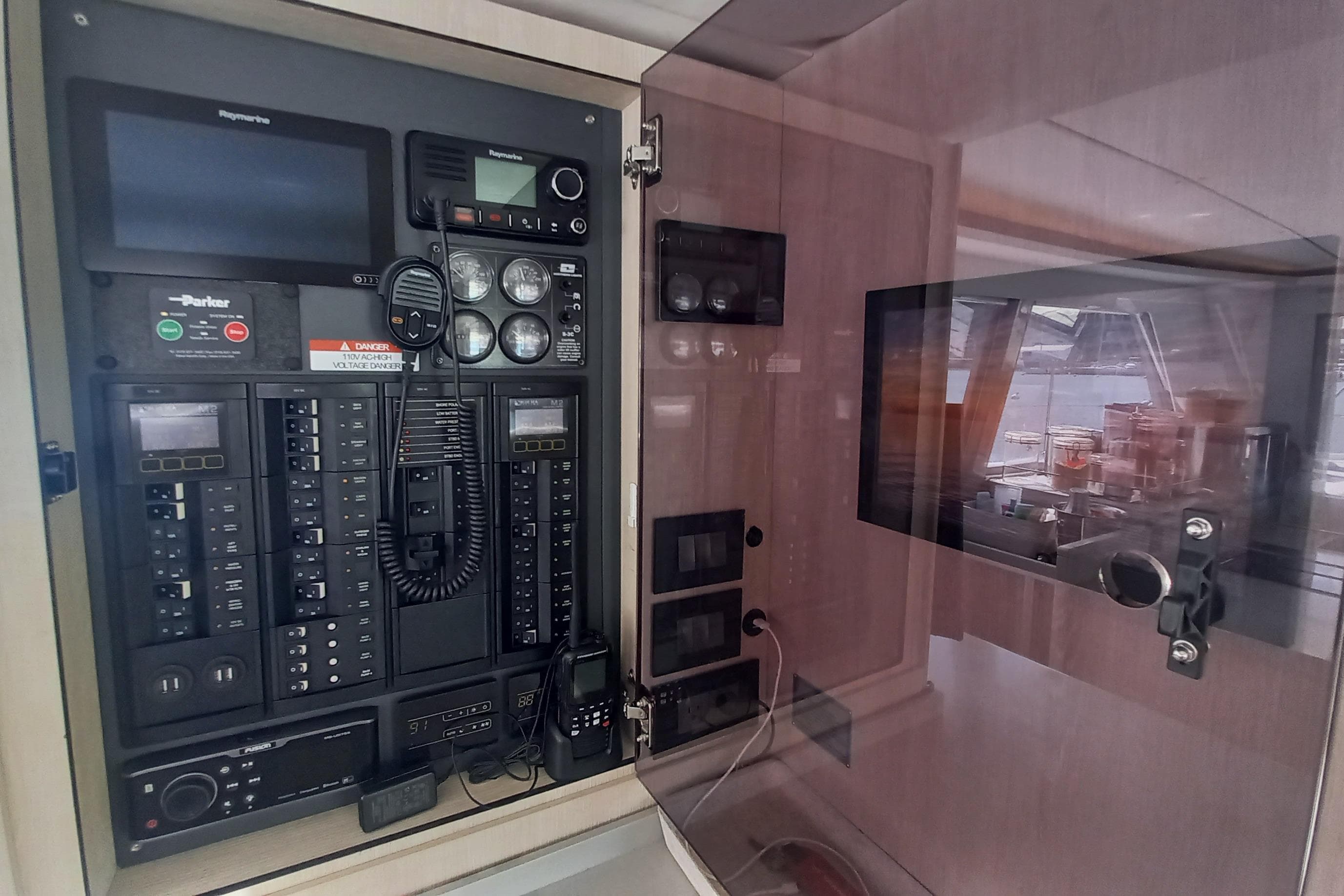 Control panel inside a 2019 Leopard 45 yacht, featuring navigation and communication equipment.