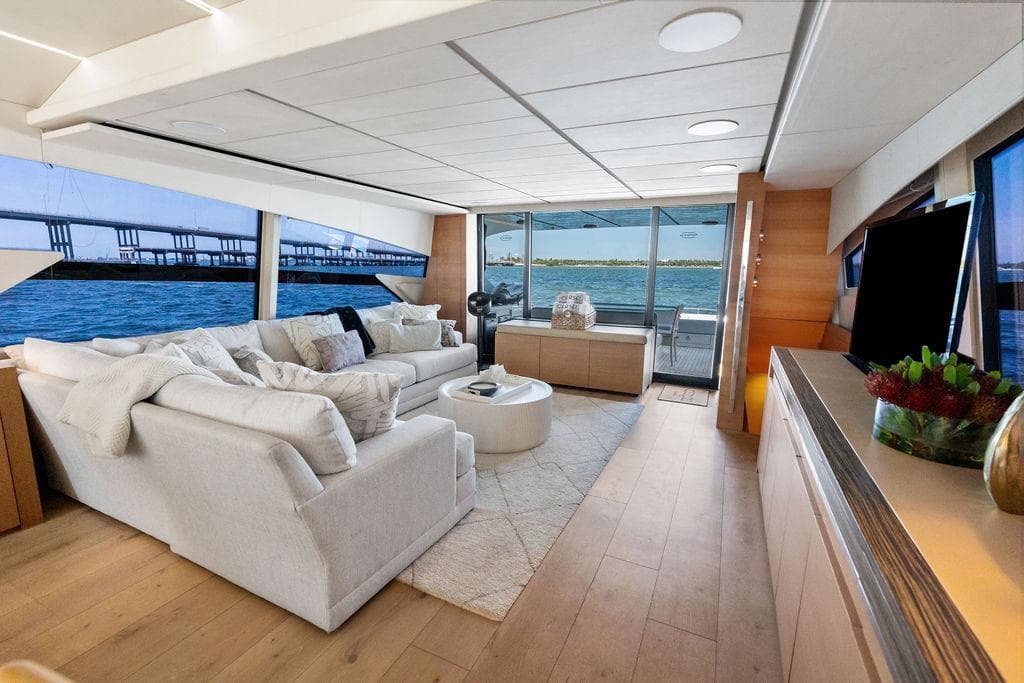 Luxurious interior of a 2012 Pershing 92 yacht with elegant seating and ocean views.