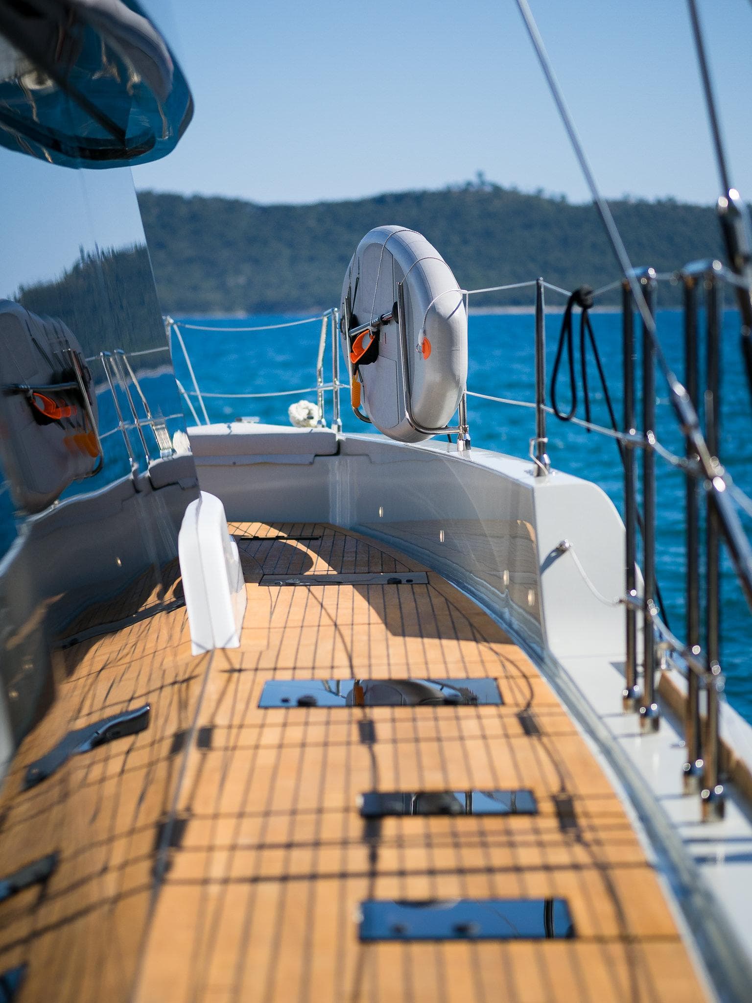 2024 Sunreef 70 Eco yacht deck with ocean view and life preserver.