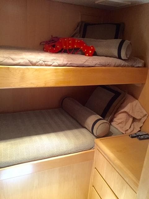 Interior of 1998 Hatteras 74 Yacht with bunk beds.