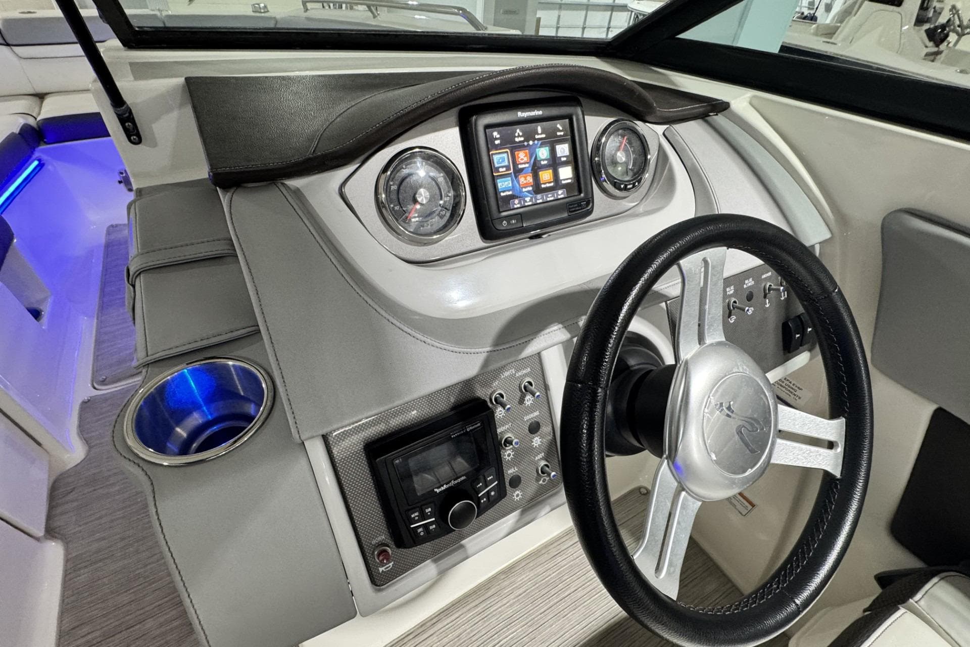 2017 Sea Ray SDX 270 Outboard dashboard with steering wheel and control panel.