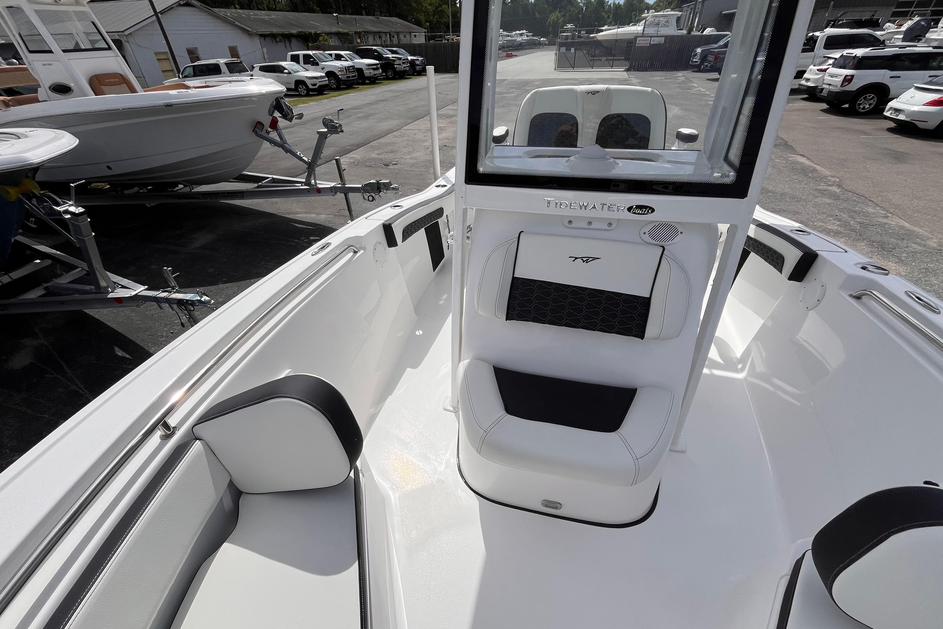 Interior view of 2026 Tidewater 210 LXF boat on a parking lot.