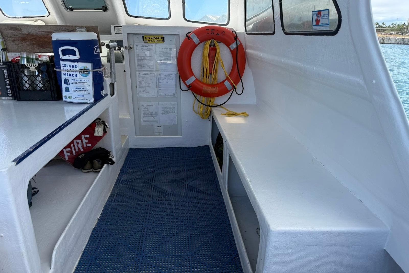Interior of a 2001 Force Power Cat boat with safety equipment and storage.