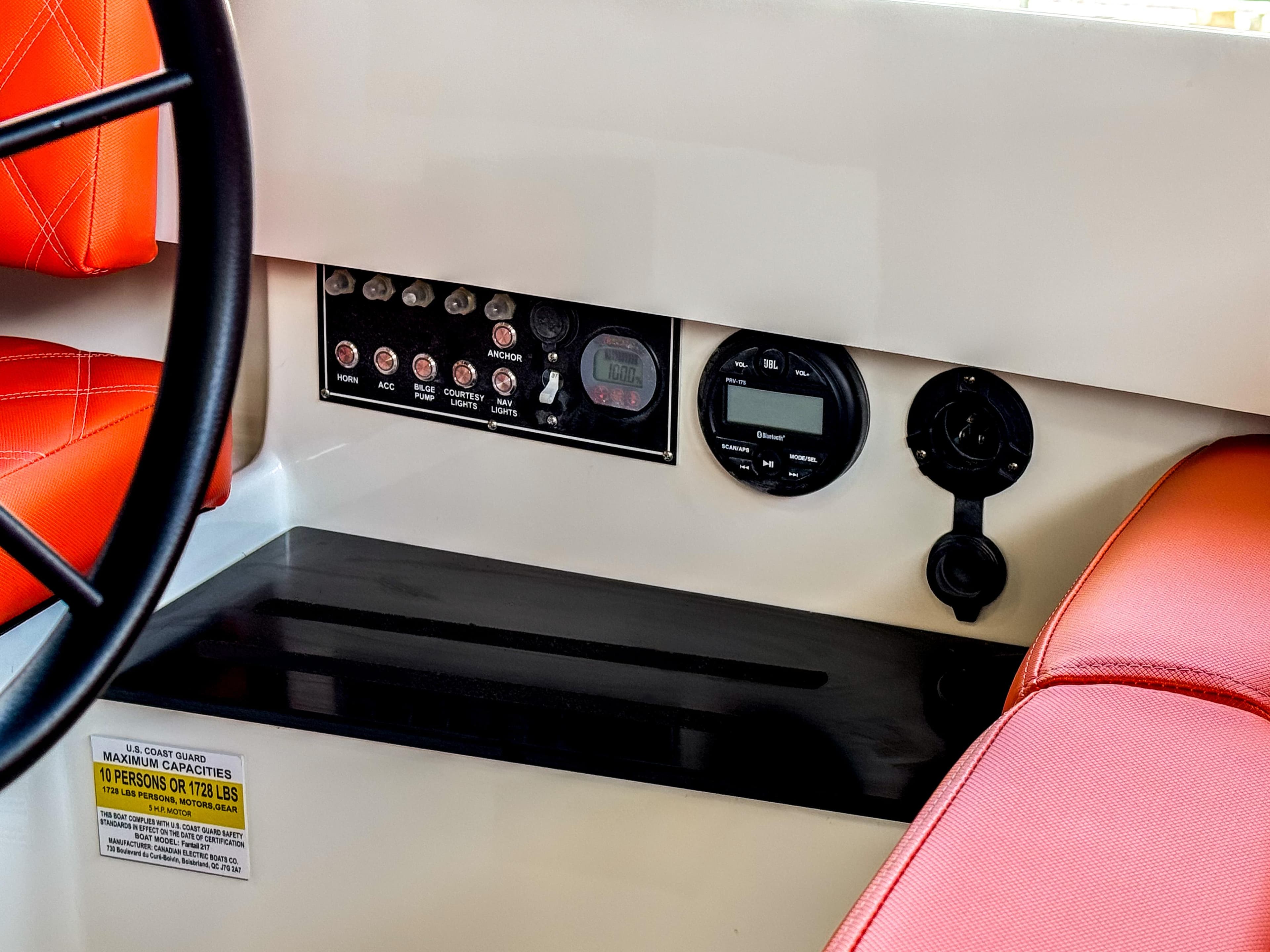 2024 Vision Marine Fantail 217 dashboard with controls, red seating, and capacity label.