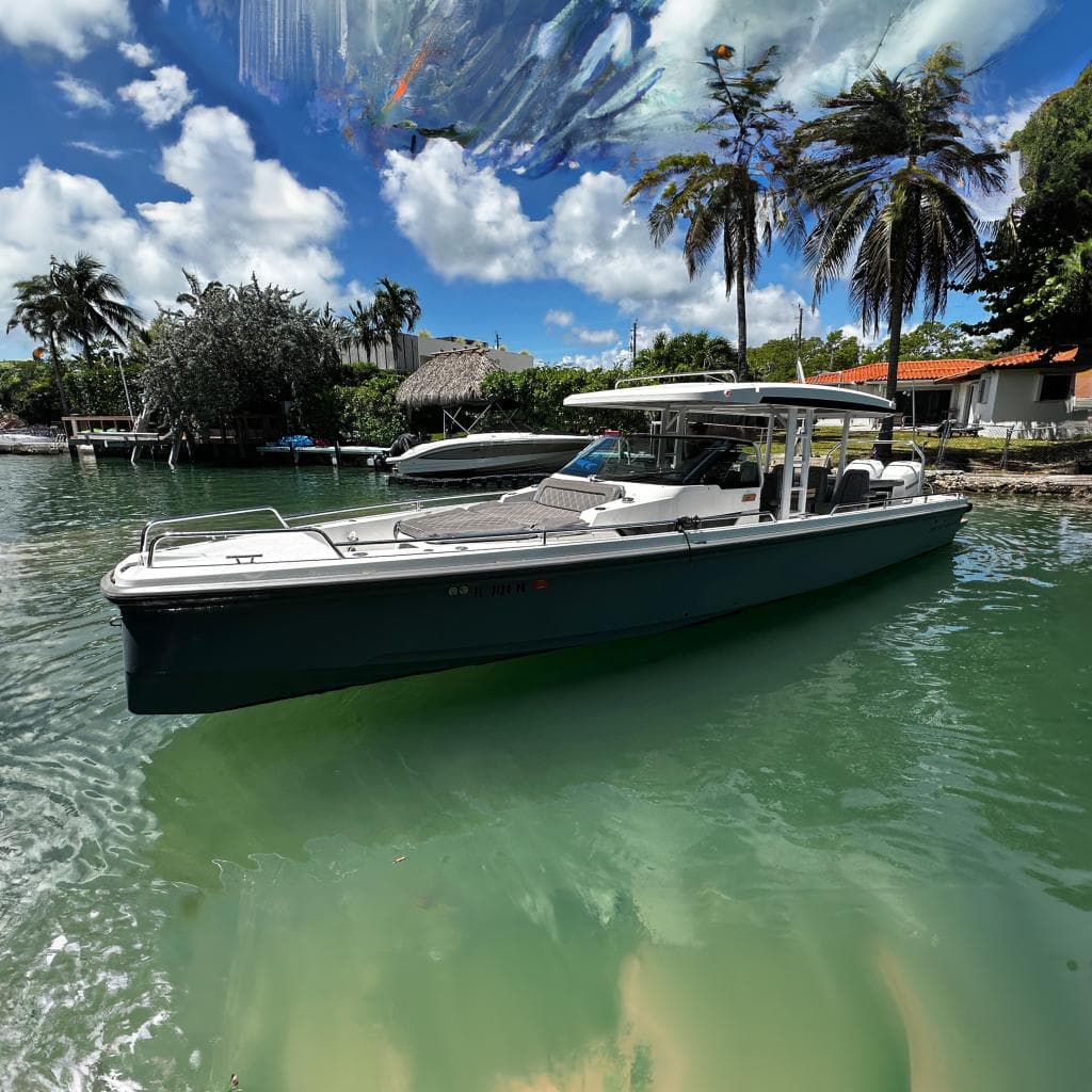 2018 Axopar 37 Sun-Top boat docked in a tropical waterfront setting.
