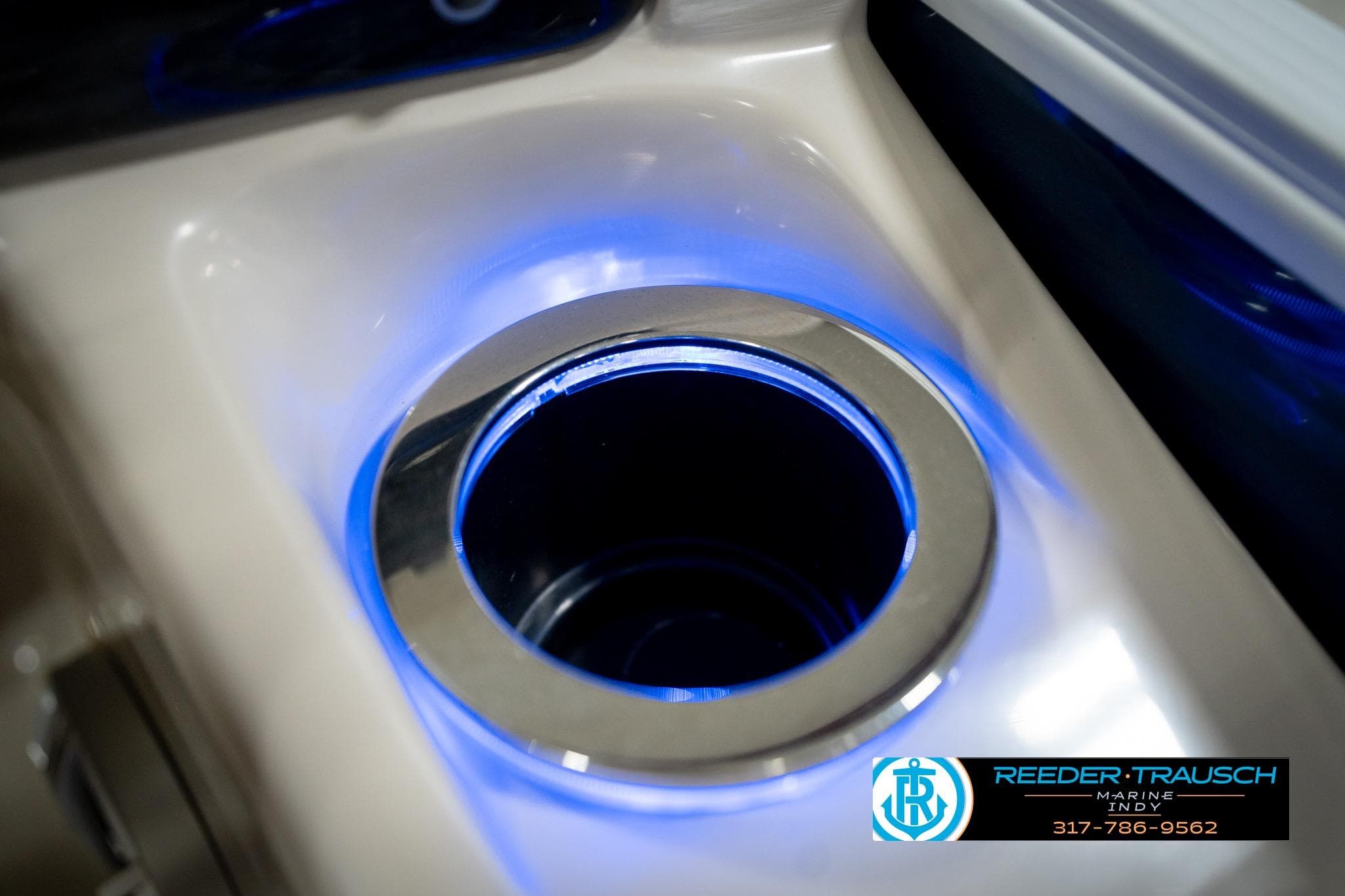 Illuminated cup holder on 2016 Bennington 2375 RSB boat, featuring blue LED lighting.