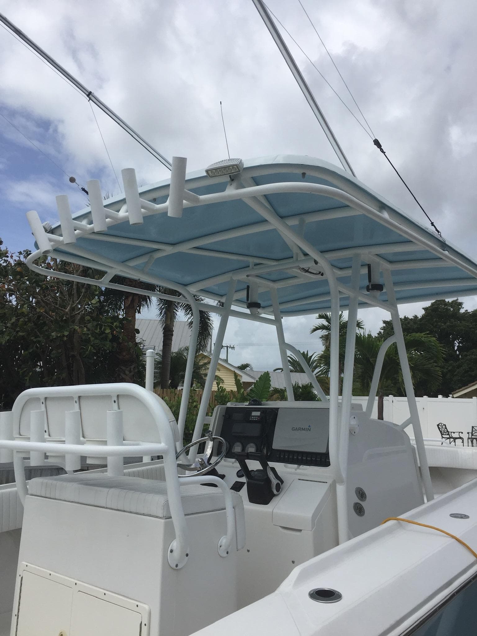 2005 Jupiter FS boat with center console and T-top.