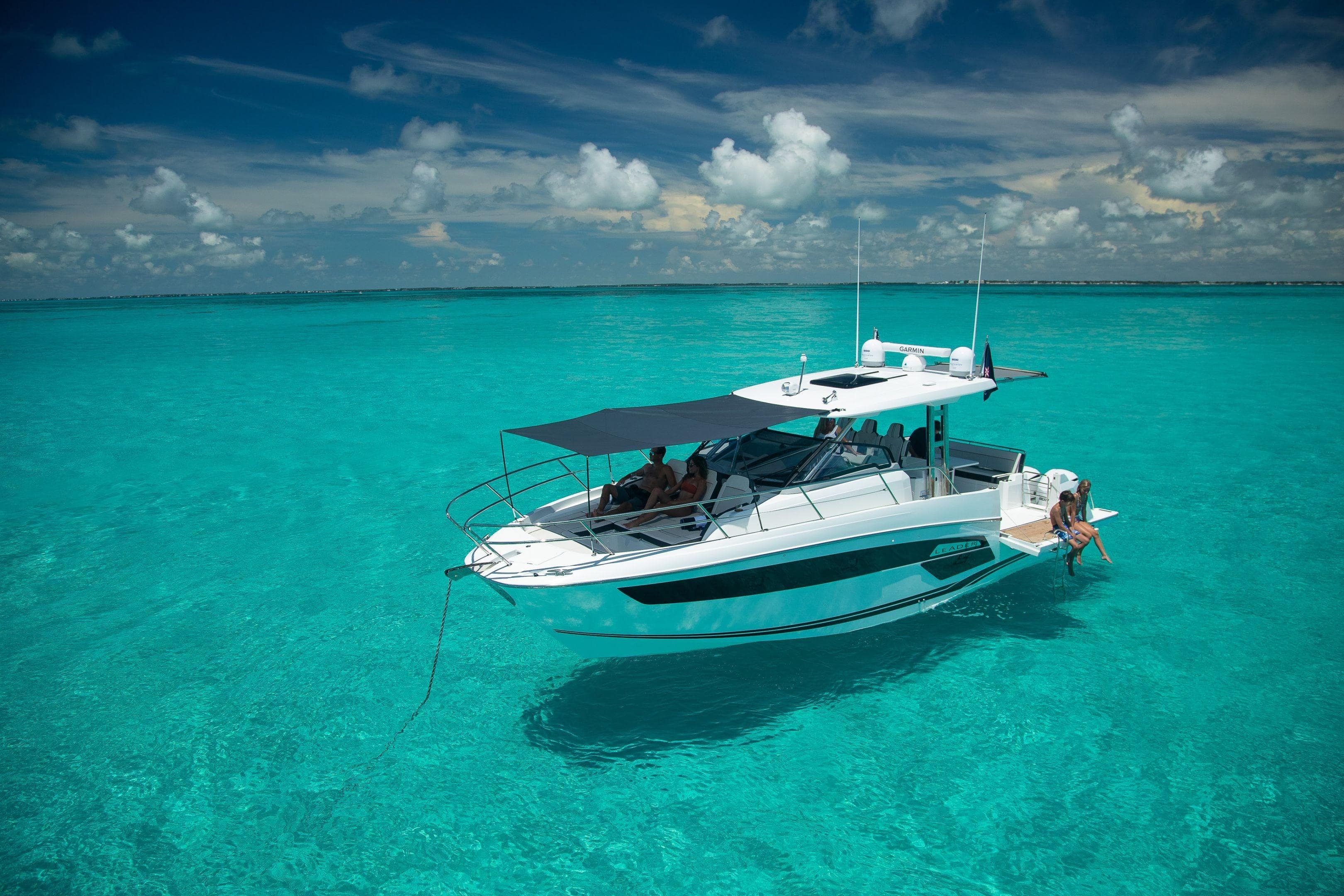 2026 Jeanneau Leader 12.5 WA cruising on clear turquoise waters under a sunny sky.