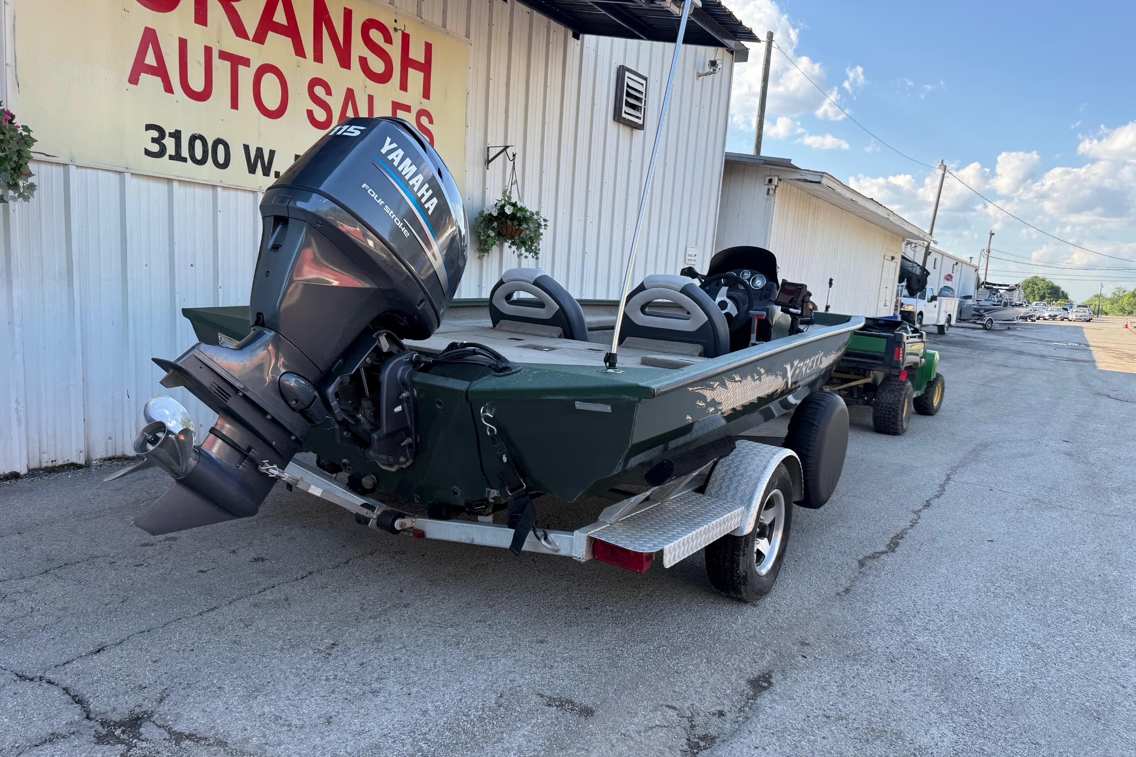 2014 Xpress H18 boat with Yamaha motor on trailer at dealership.