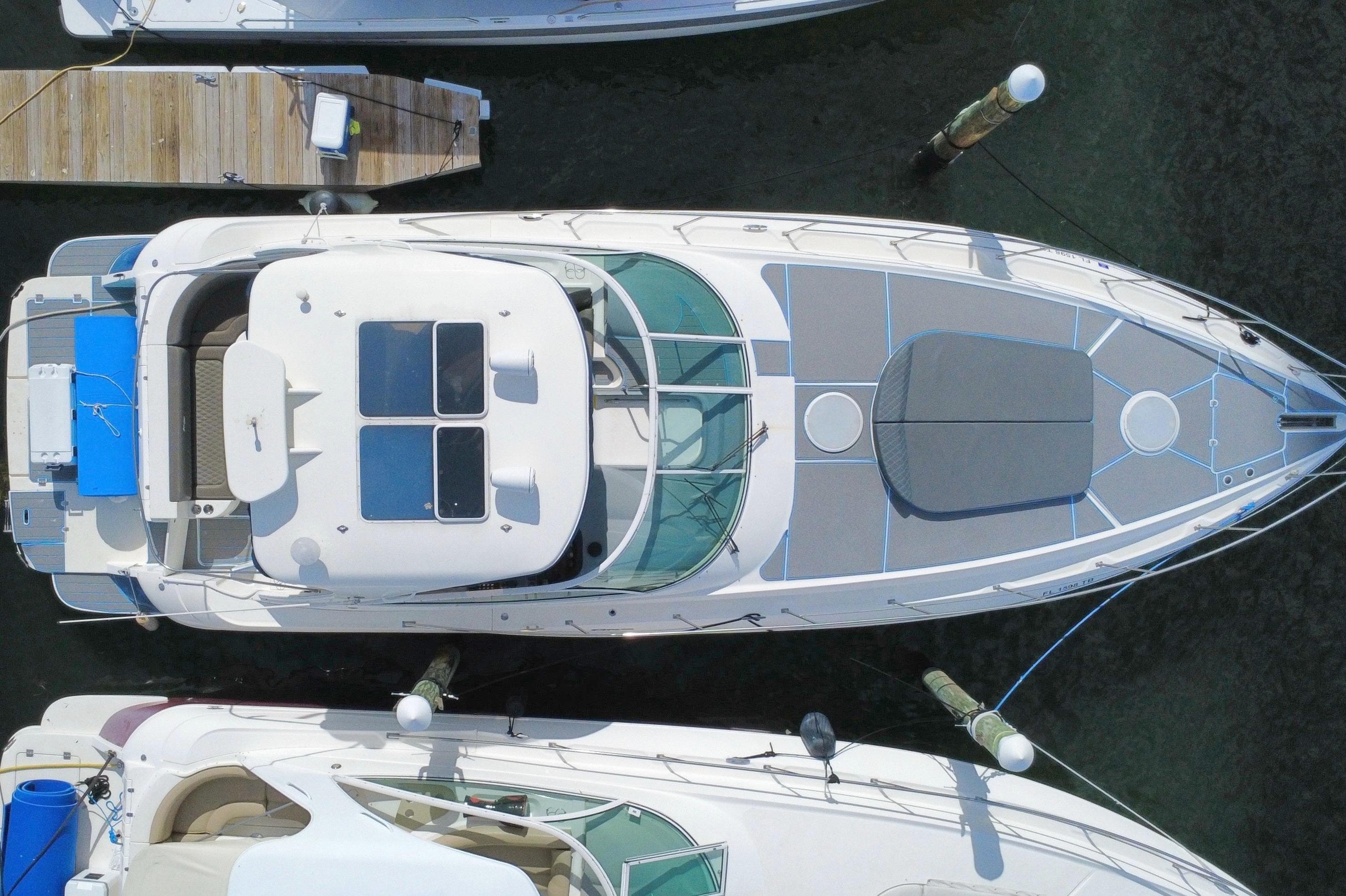 Aerial view of 2005 Cruisers Yachts 440 Express docked at marina.