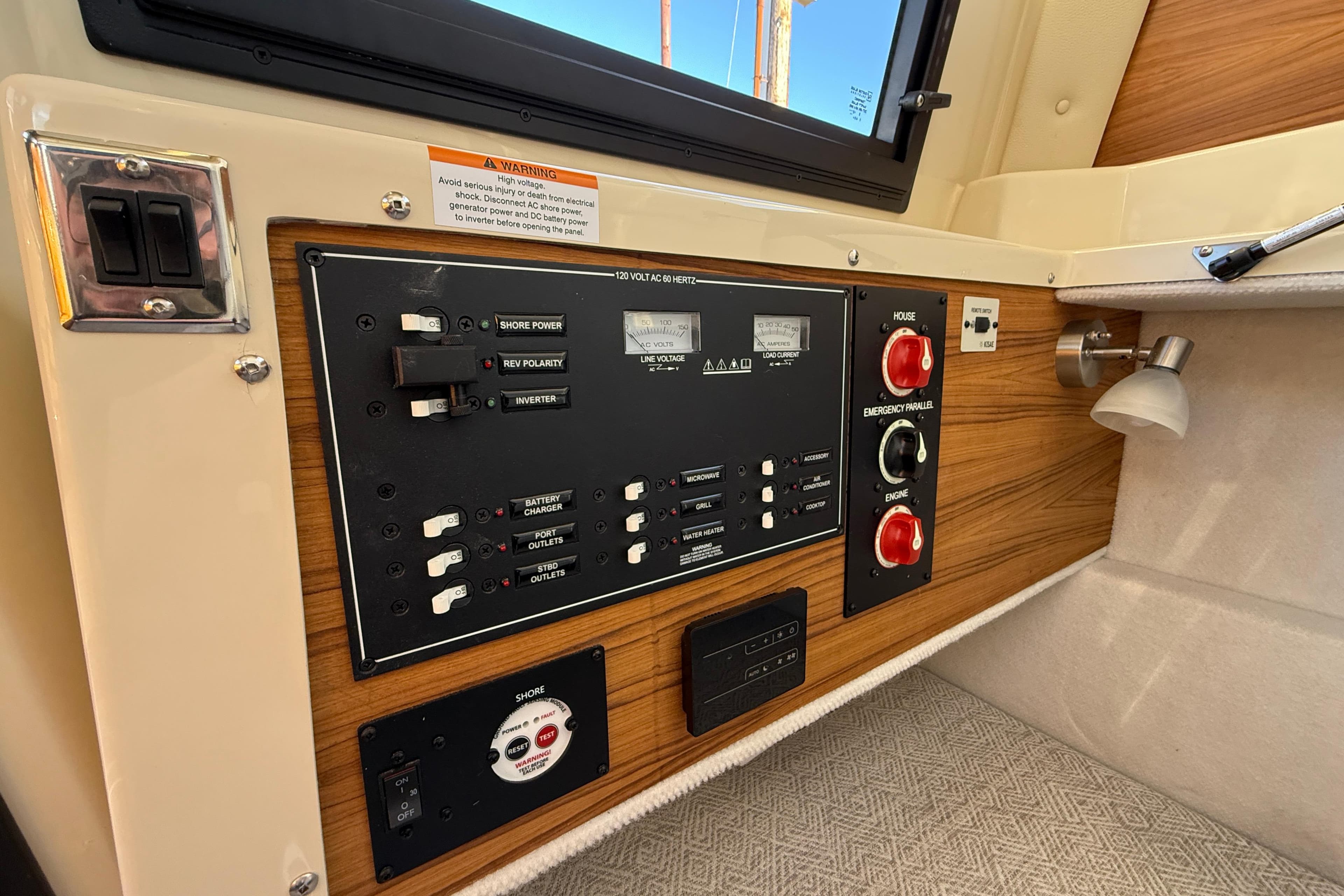Control panel of 2026 Ranger Tugs R-23 boat, featuring switches and gauges.