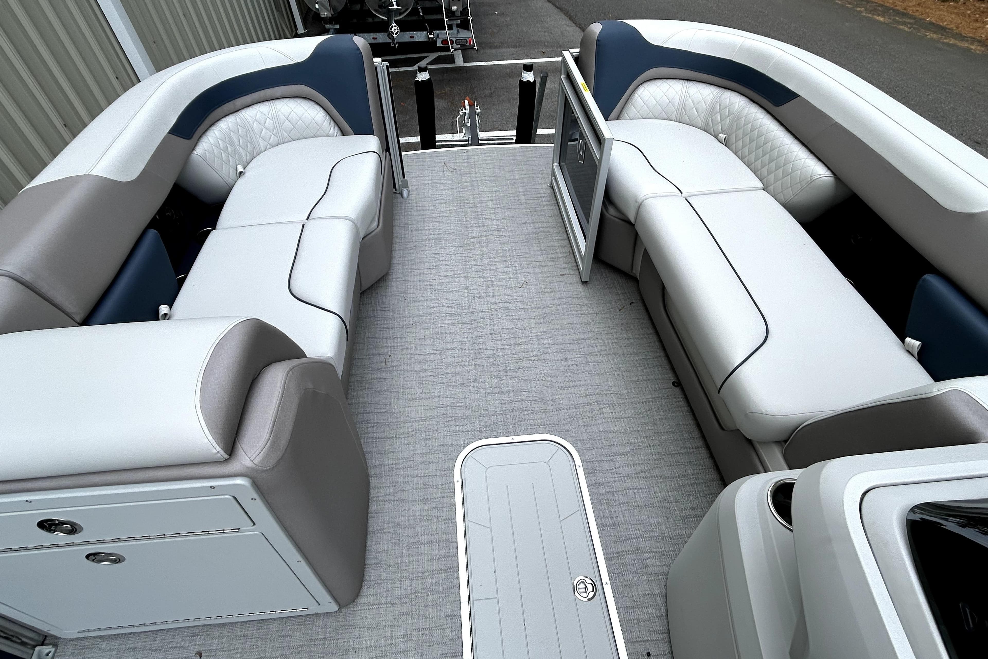 Interior of 2026 Godfrey Sweetwater 2286 SFLC pontoon boat with plush seating.