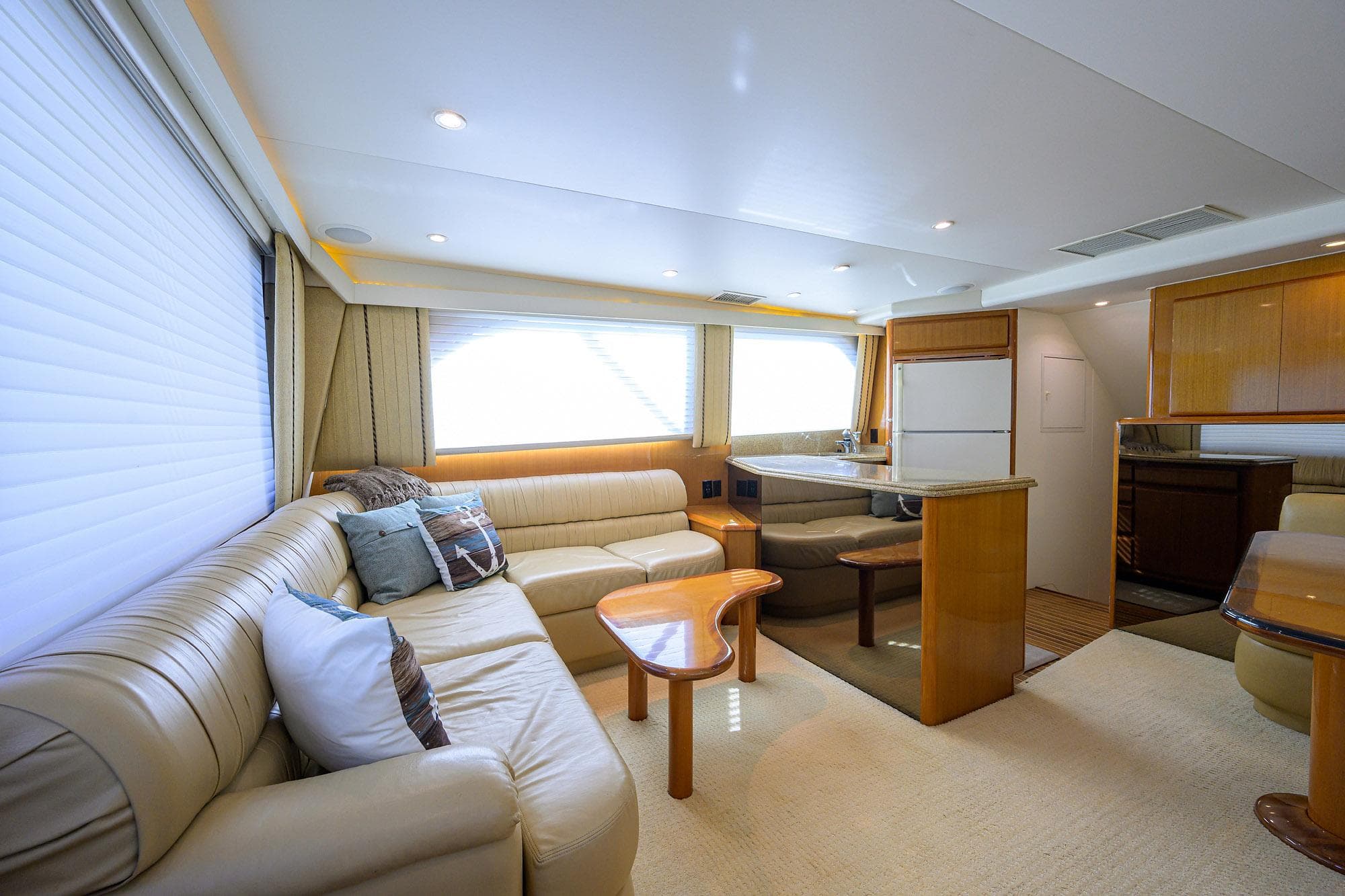 Luxurious interior of 2000 Viking 50 Convertible yacht with plush seating and modern amenities.