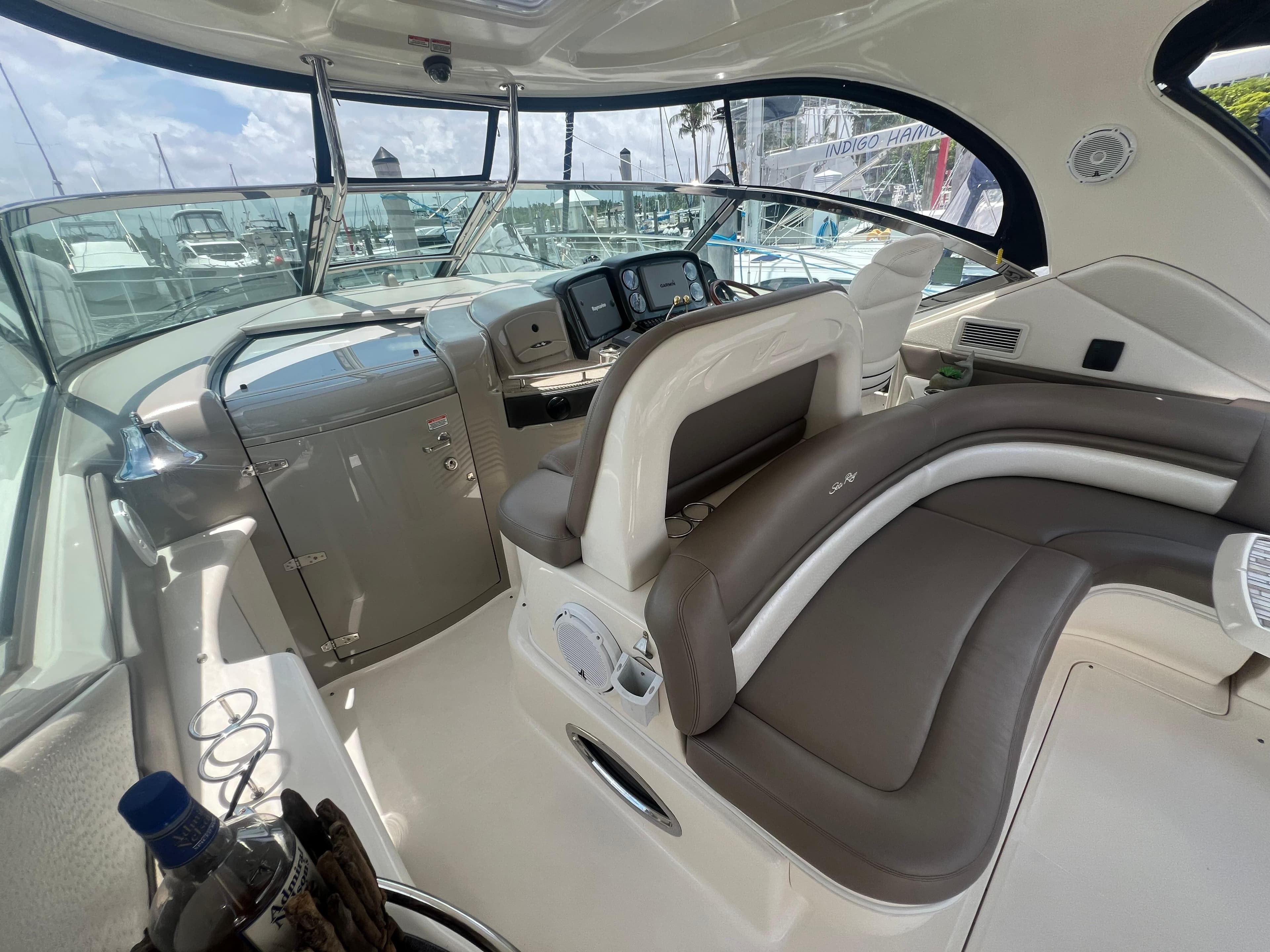 Interior of 2005 Sea Ray 420 Sundancer yacht with modern helm and seating.
