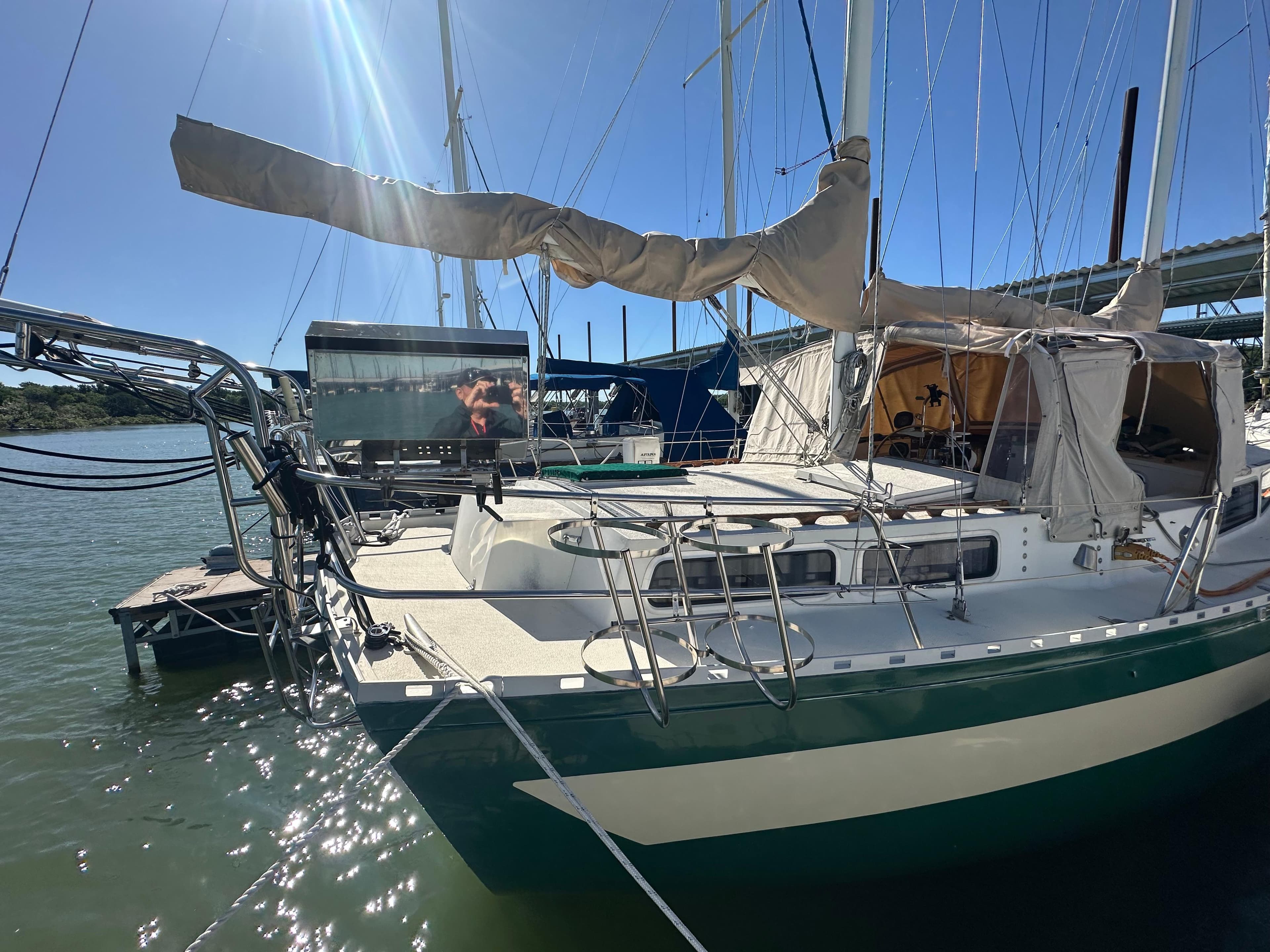 1981 Islander Freeport Ketch sailboat docked in sunny marina.