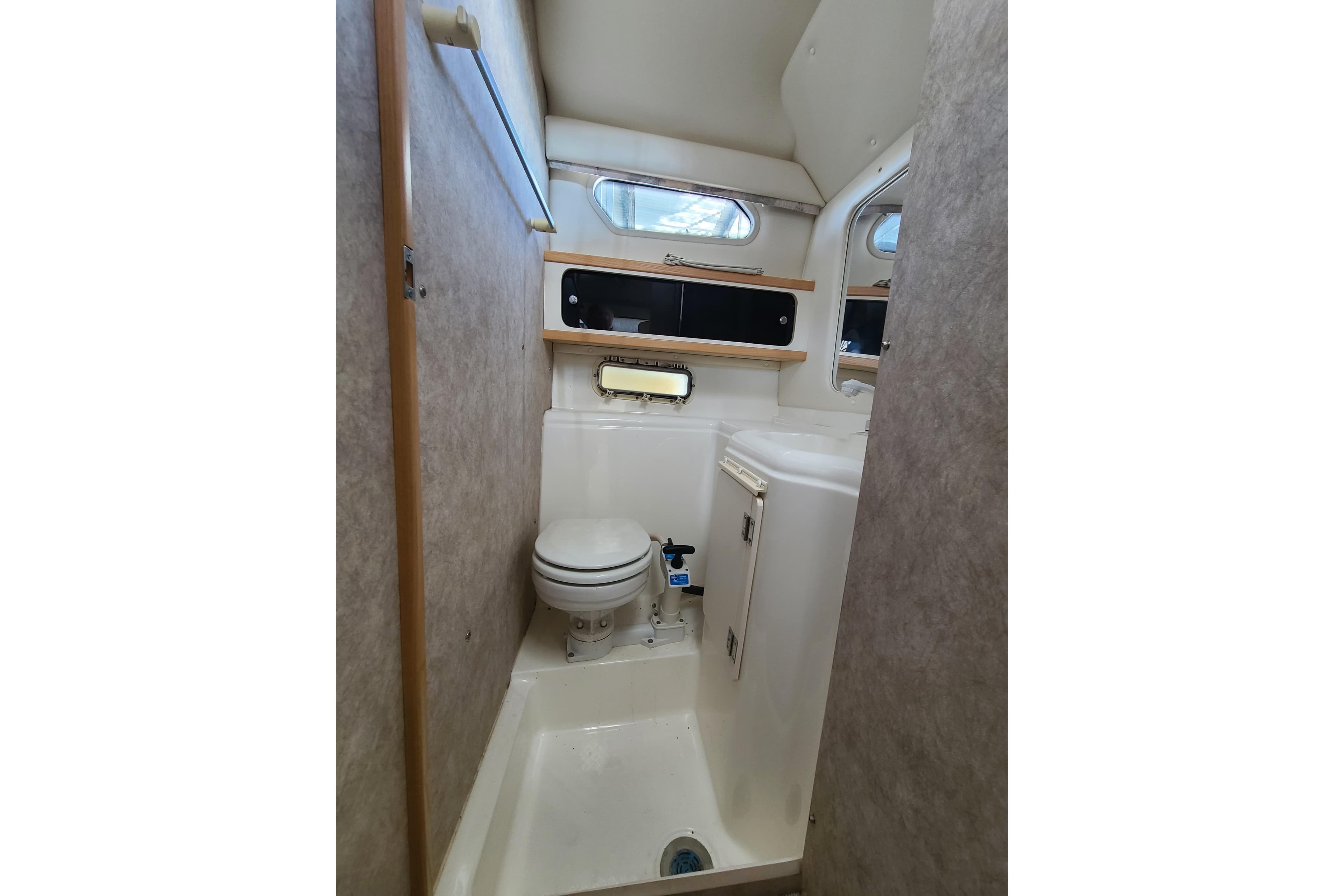 1998 Bayliner 2855 Ciera Sunbridge bathroom interior with toilet and sink.