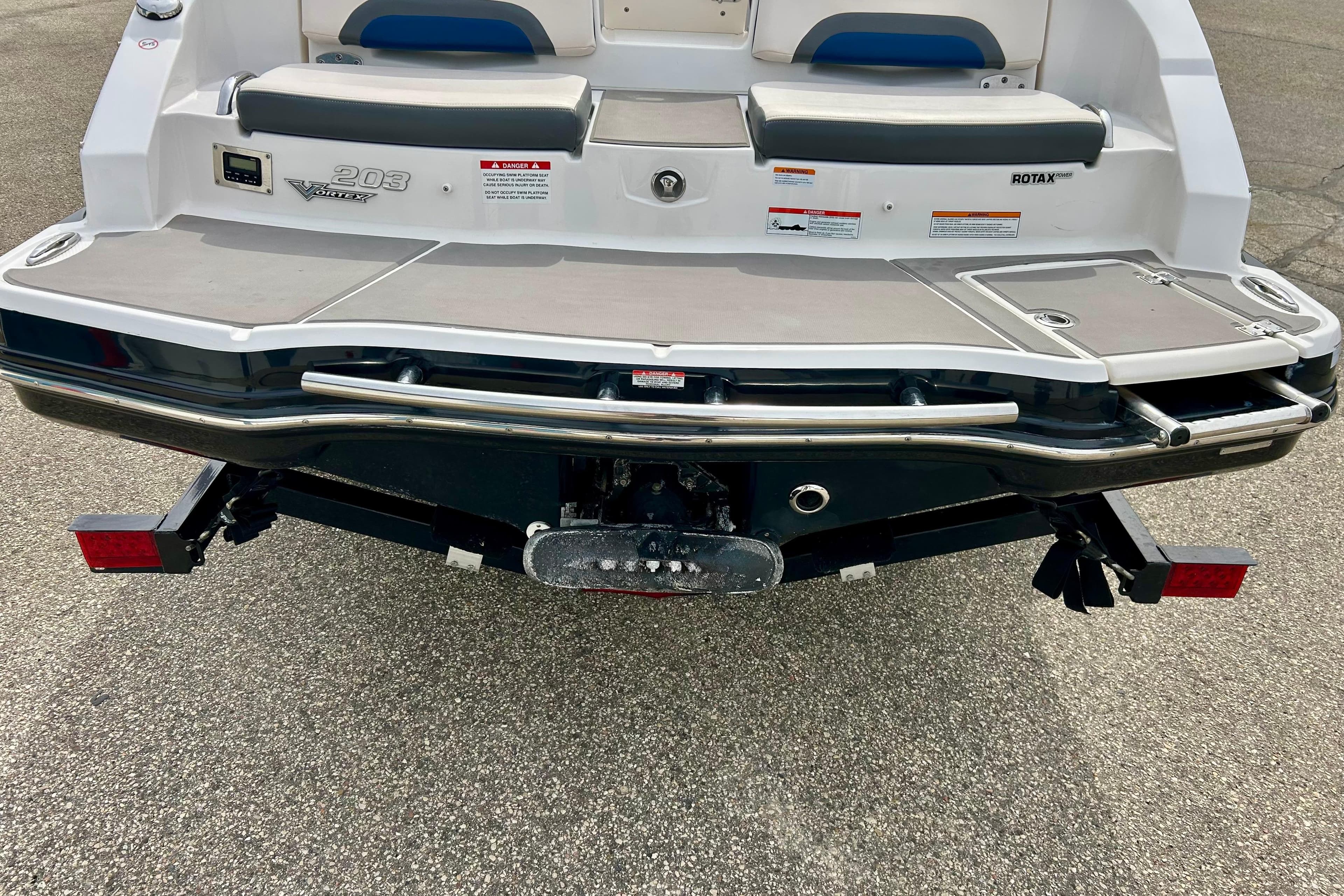 Rear view of 2017 Chaparral 203 Vortex boat with swim platform and seating.