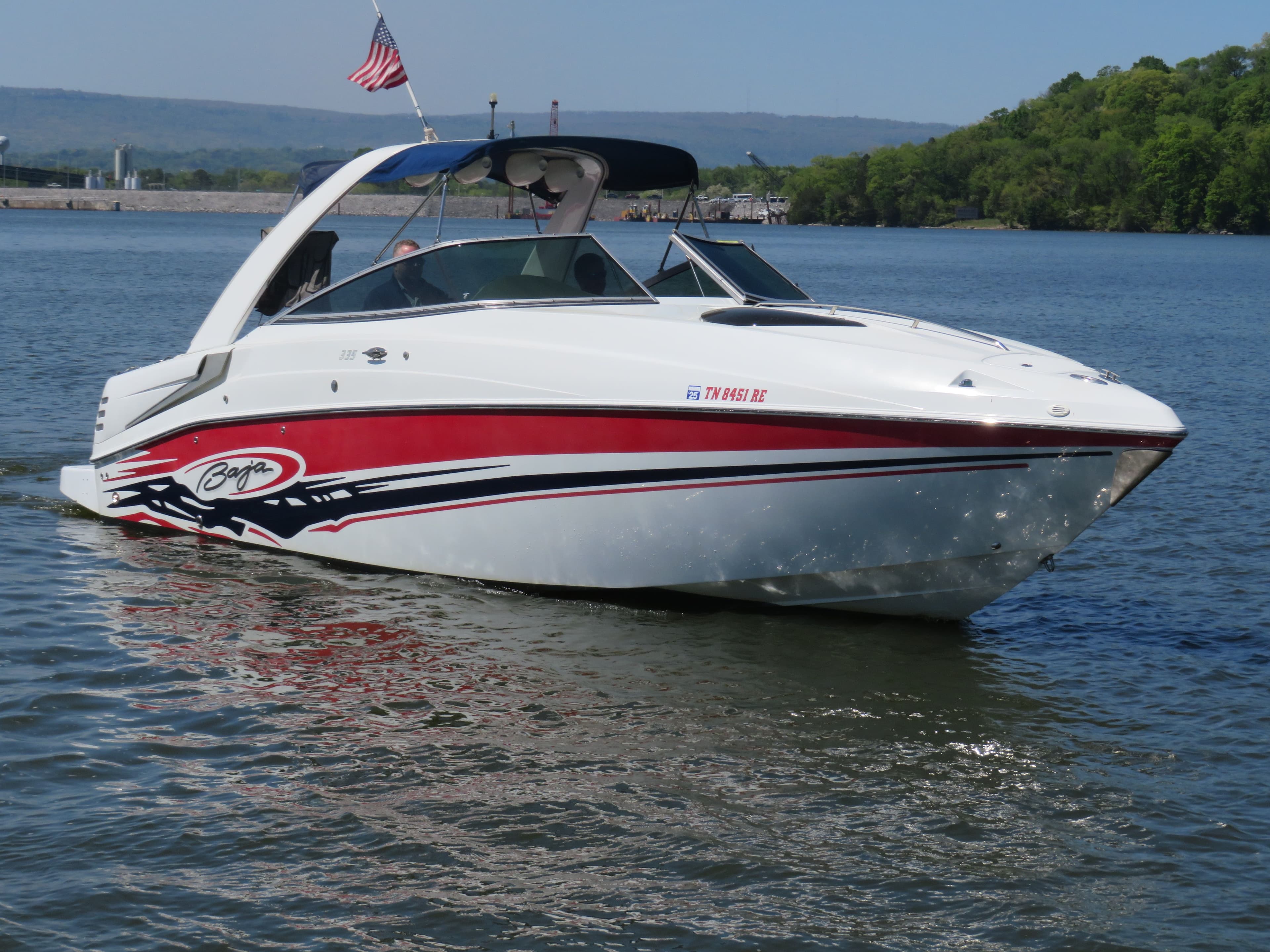 2008 Baja 335 Performance boat on calm water.