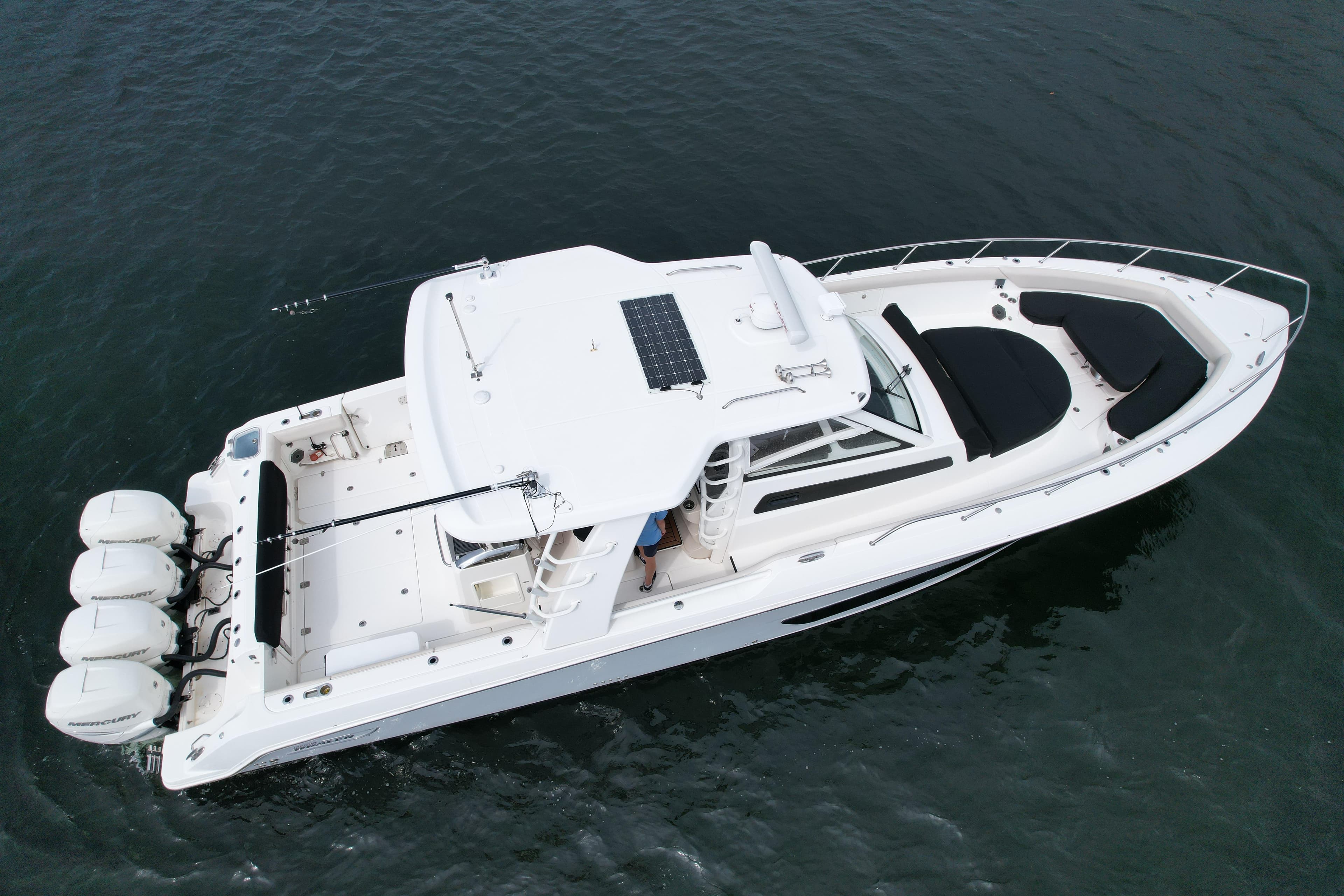 2020 Boston Whaler 420 Outrage boat with four engines on open water.