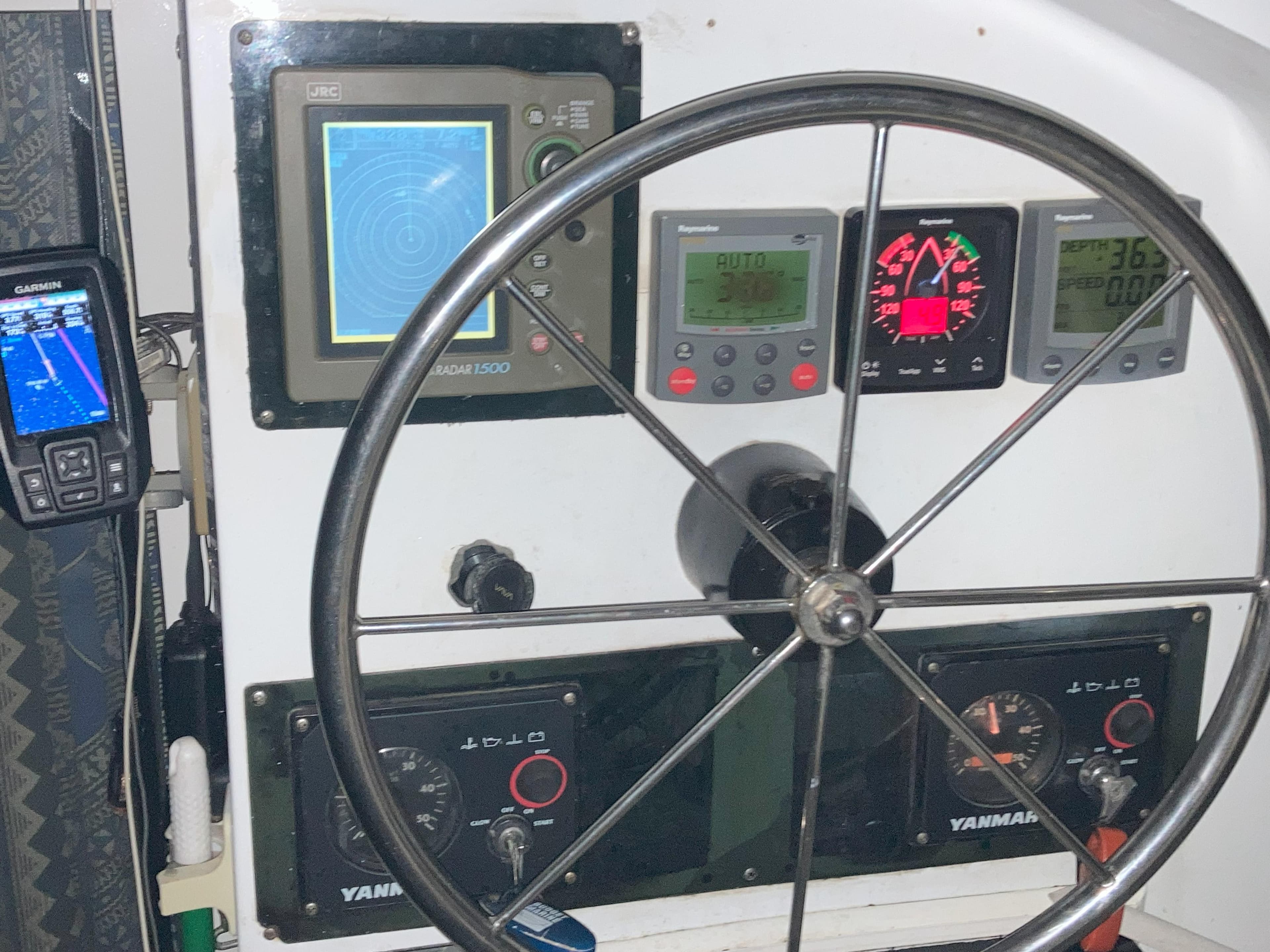 Steering wheel and navigation instruments on a 2002 Wildcat MKIII boat.