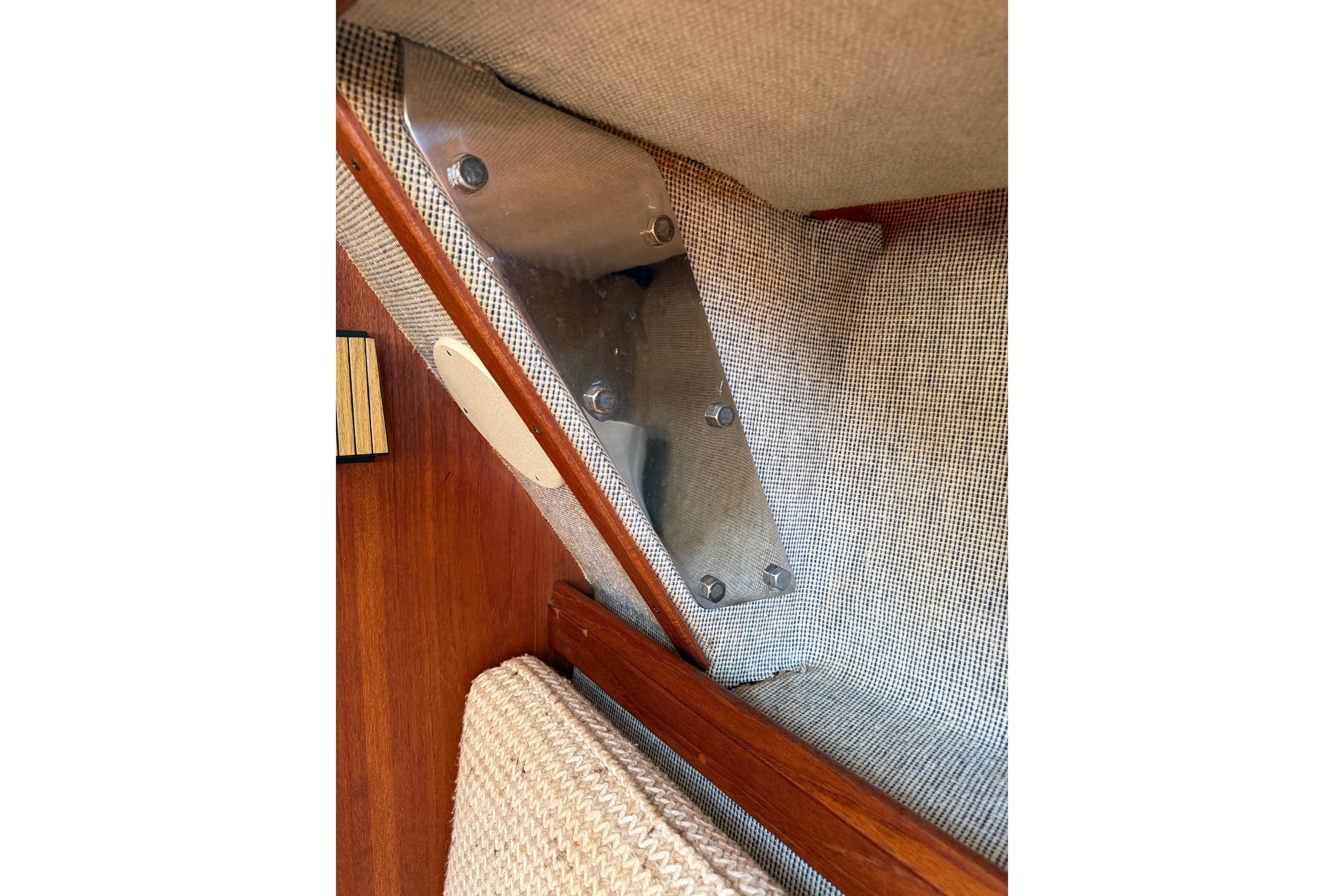Interior detail of 1985 S2 11.0 meter A sailboat, showcasing wood and fabric elements.