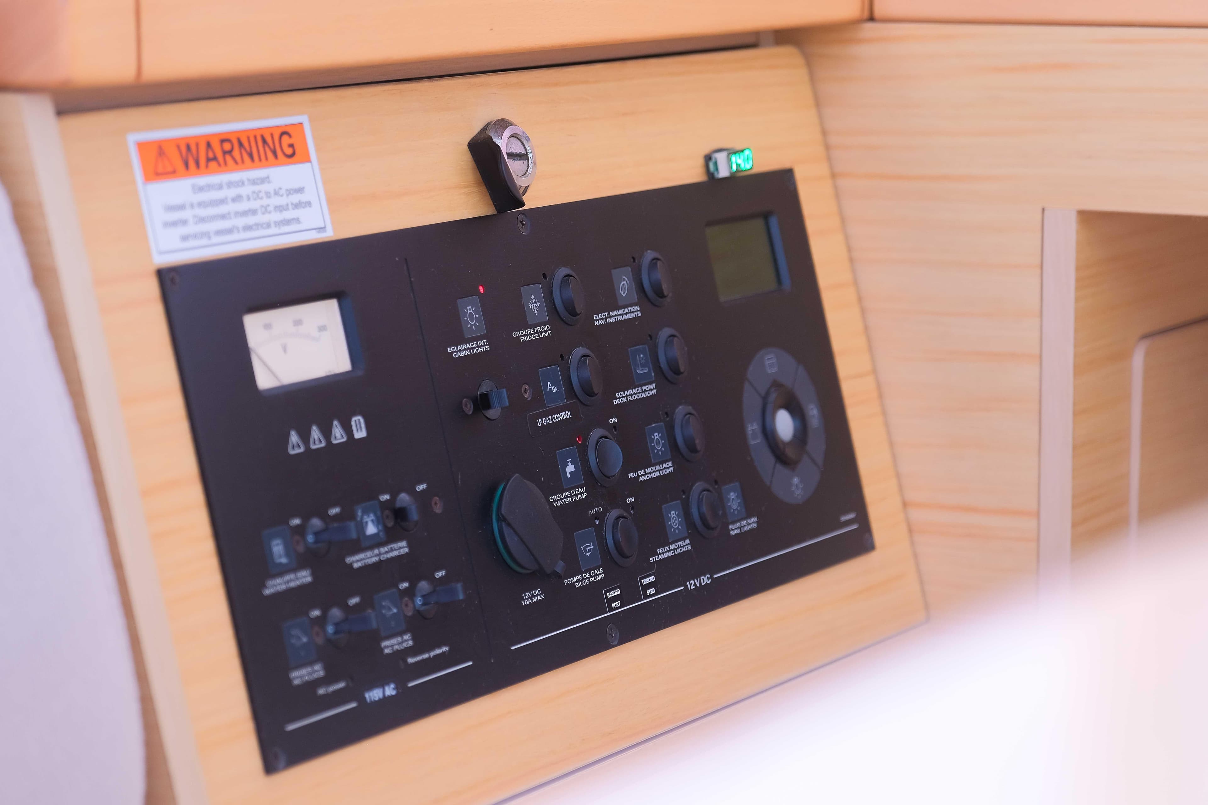 Control panel of a 2015 Lagoon 400 S2 yacht, featuring various switches and indicators.