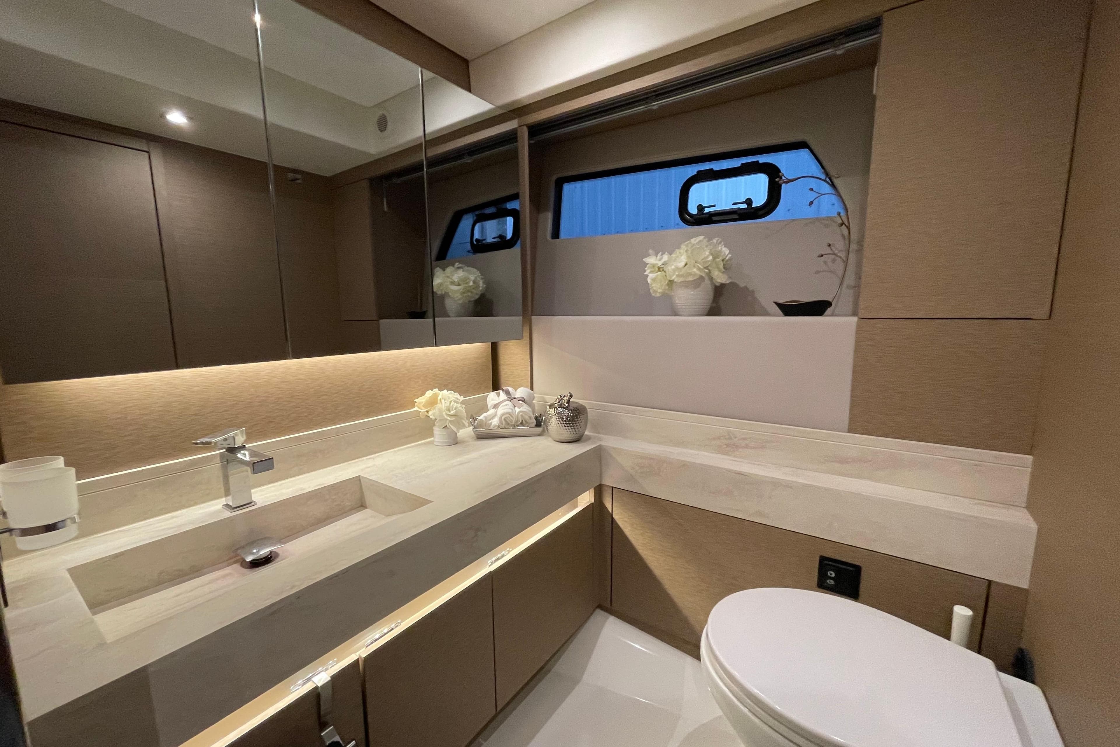 Luxurious bathroom interior of 2018 Prestige 520 yacht with modern fixtures and elegant decor.