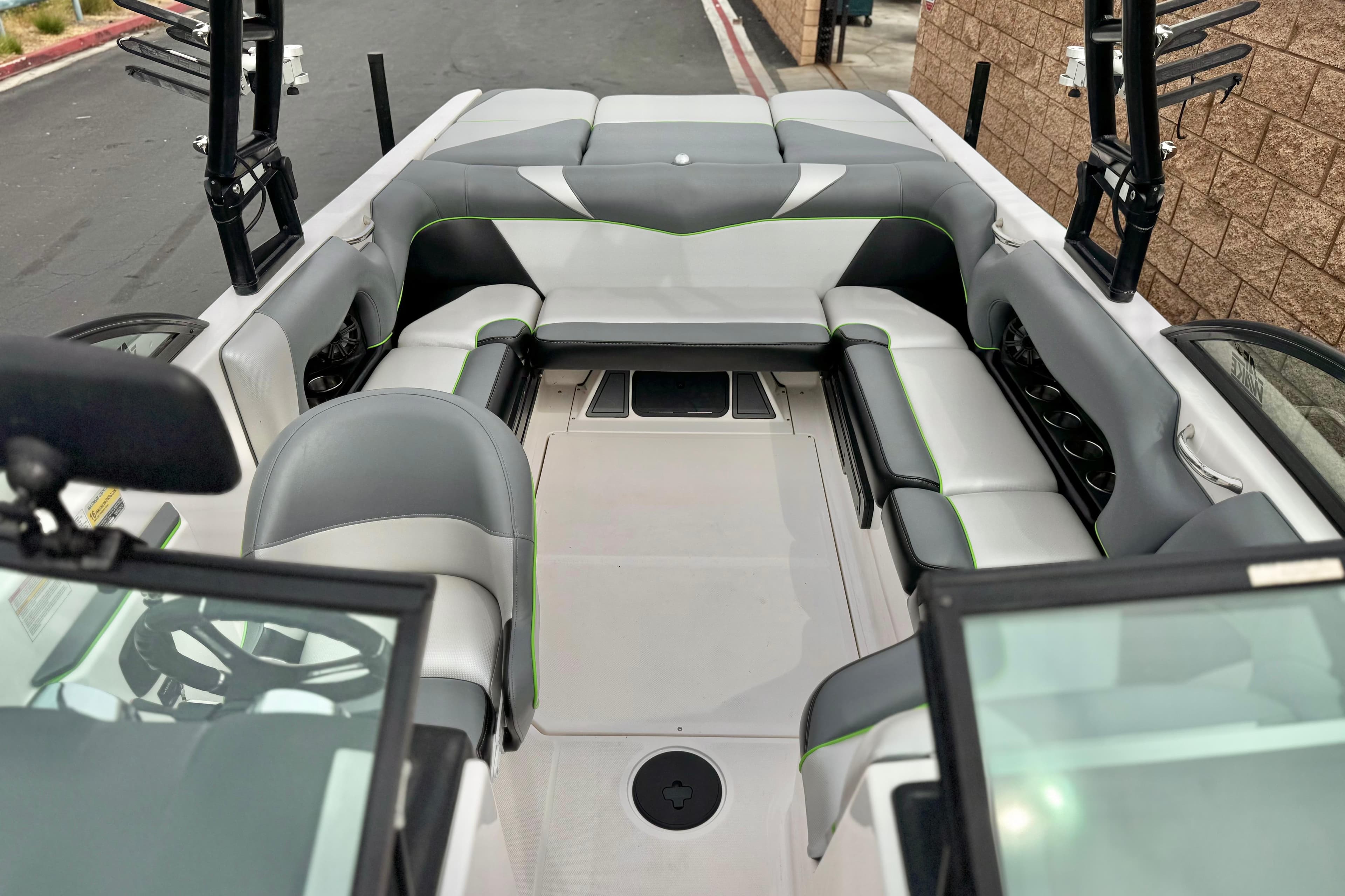 2016 Moomba Craz boat interior with gray seating and green accents.