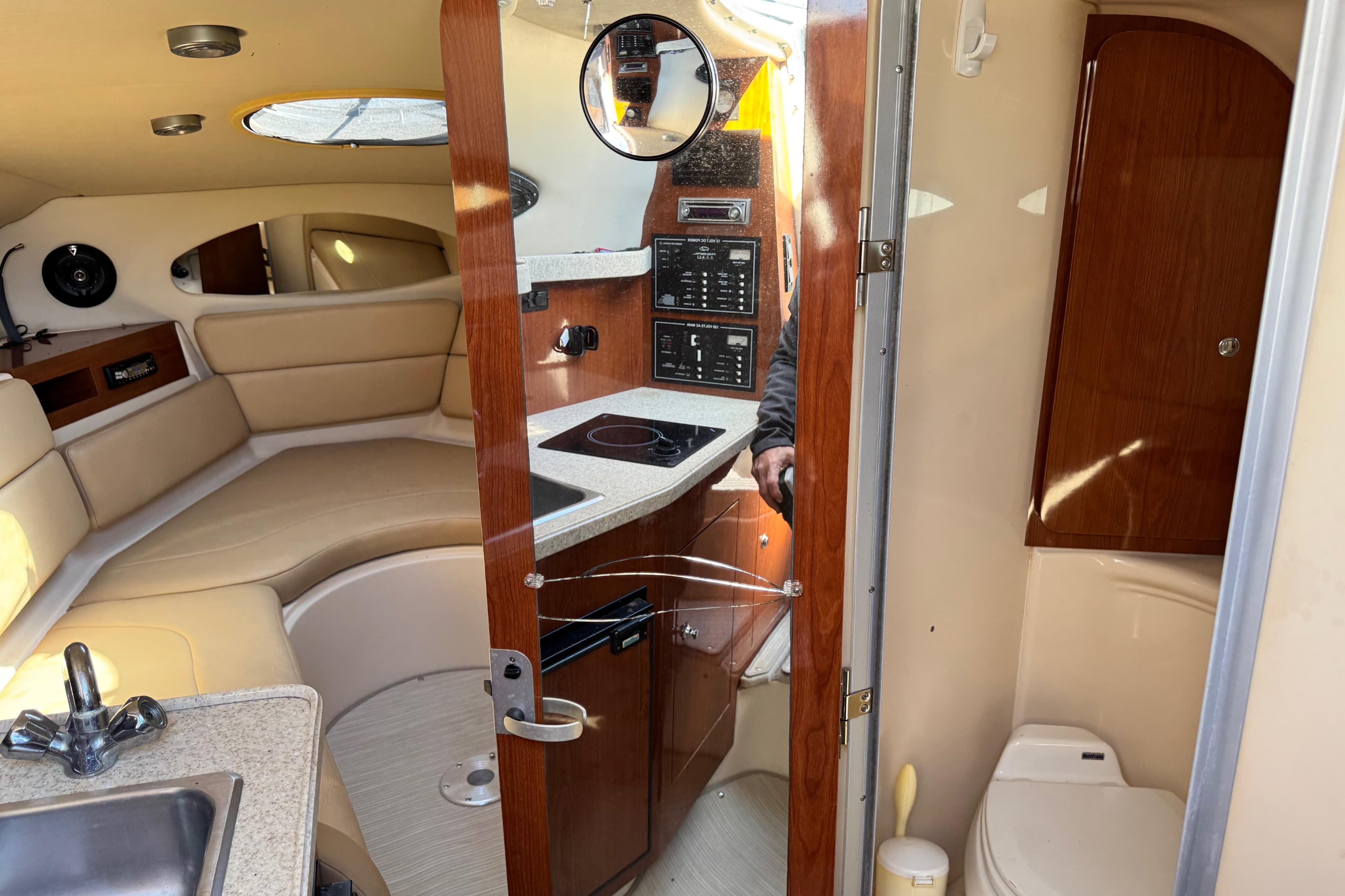 Interior of 2007 Regal Commodore 2665 boat with kitchenette and seating area.