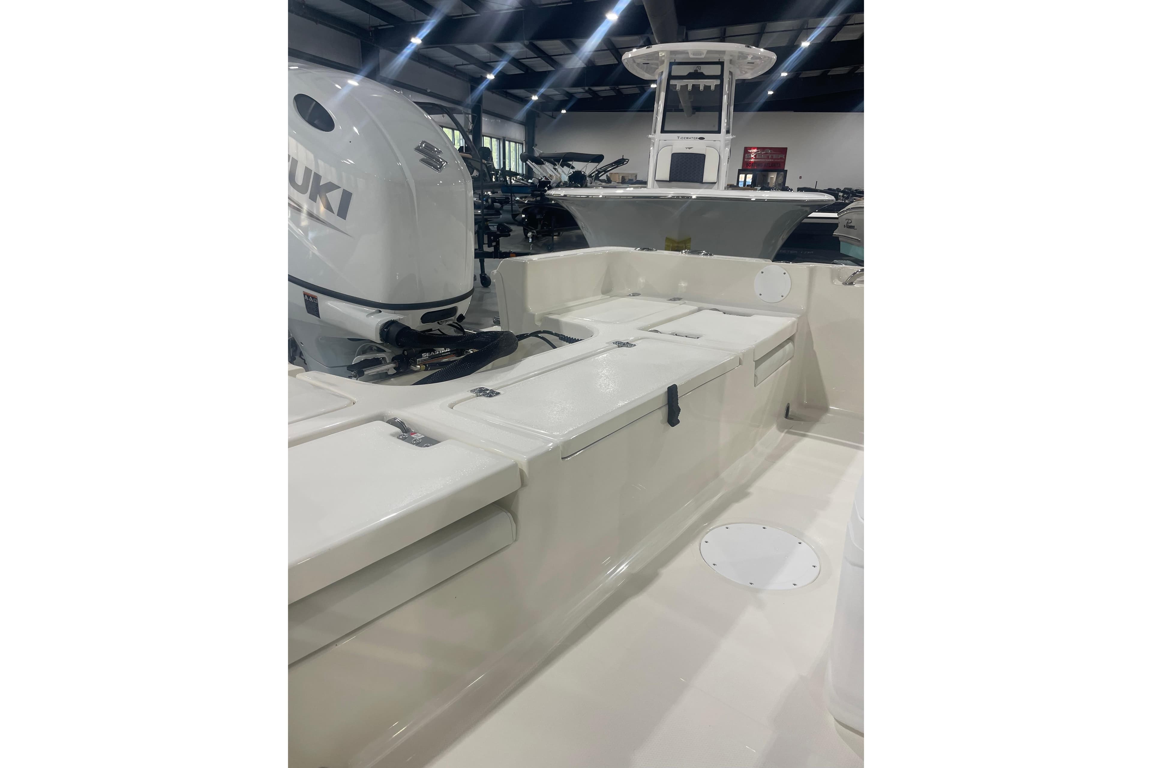 2026 Bulls Bay 2200 XS boat interior with Suzuki engine in showroom.