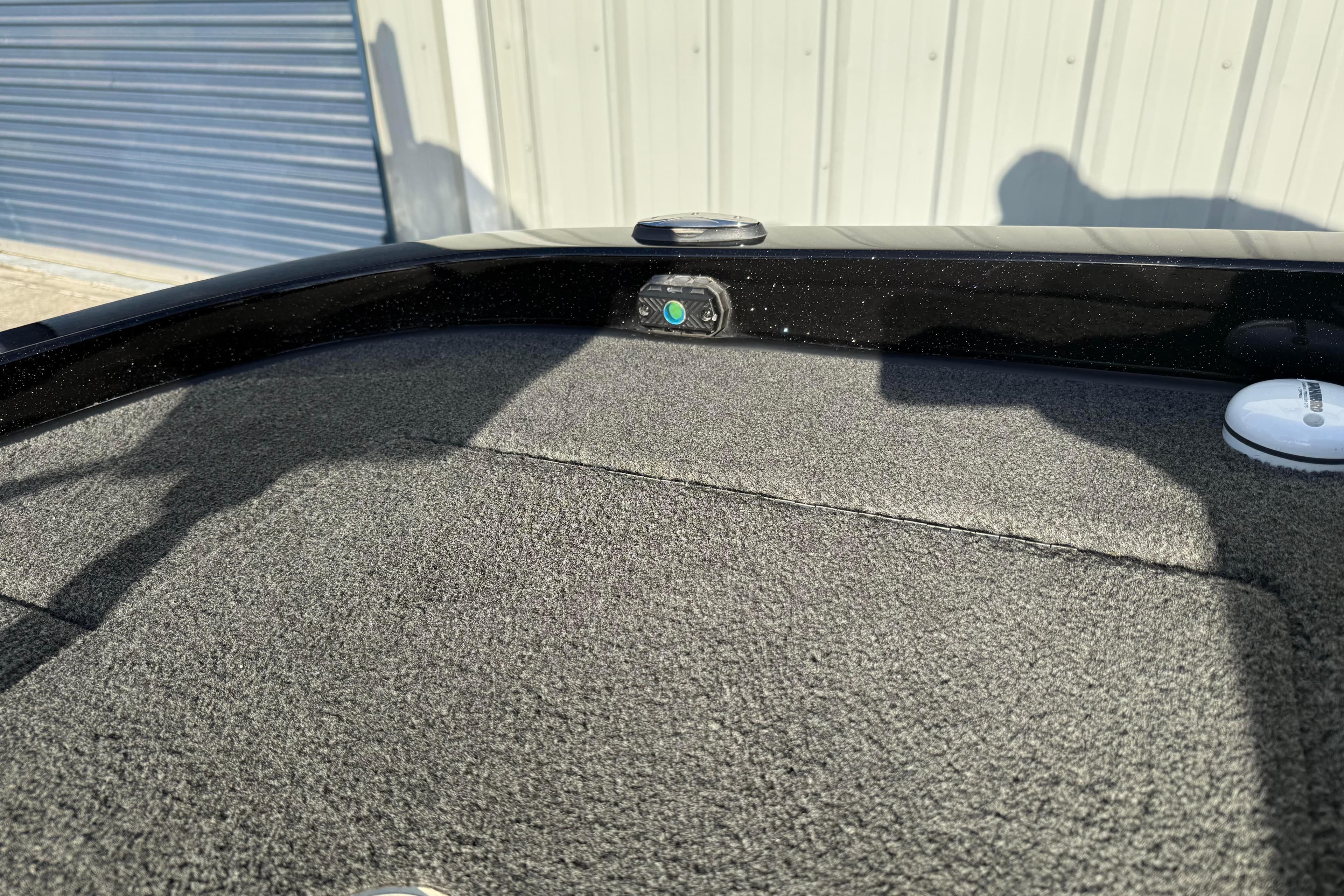 2015 Ranger Z118 Comanche boat deck with carpet and storage compartments.