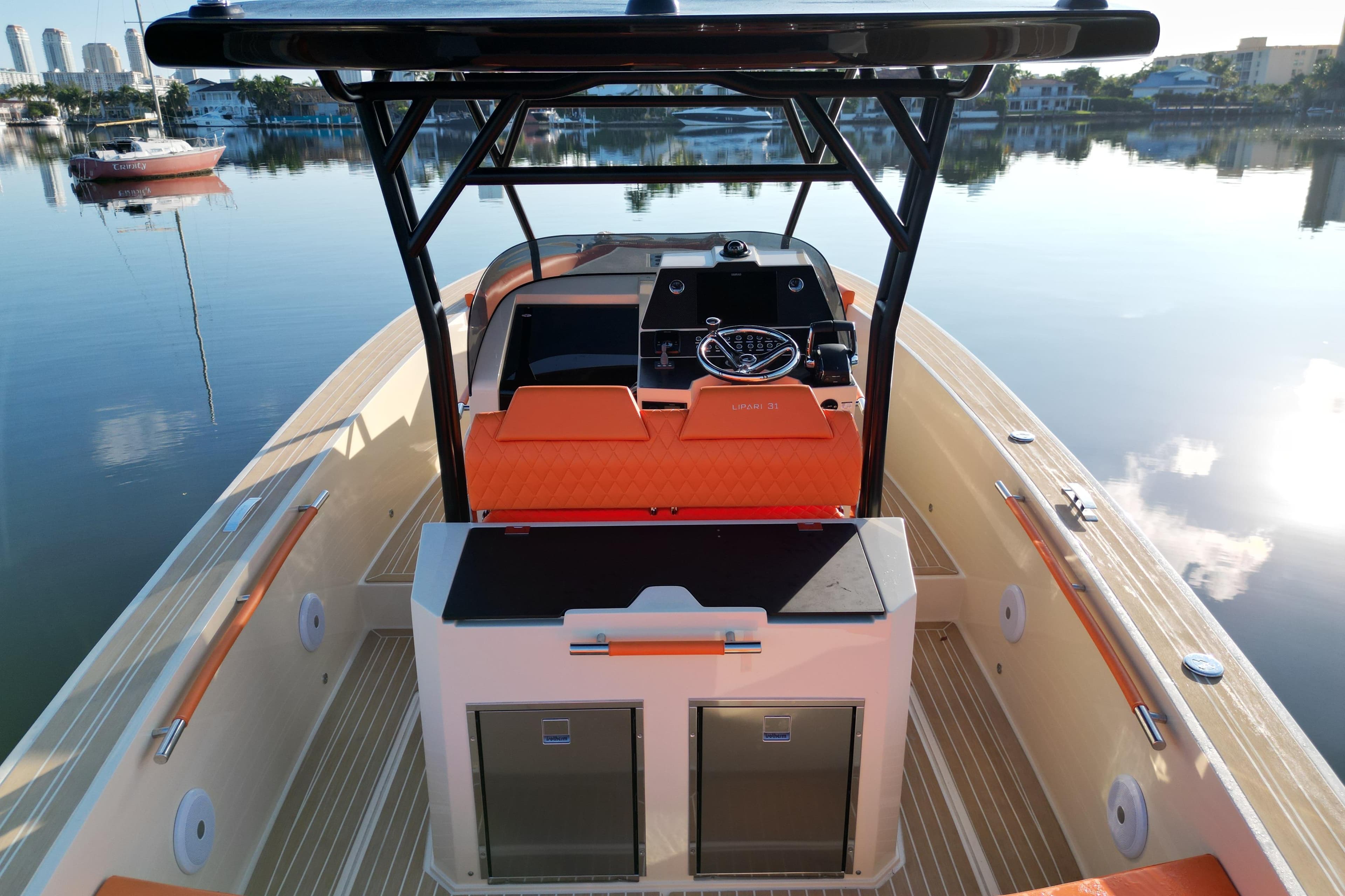 2026 Lilybaeum Lipari 31 boat interior with orange seating, sleek design, and modern controls.