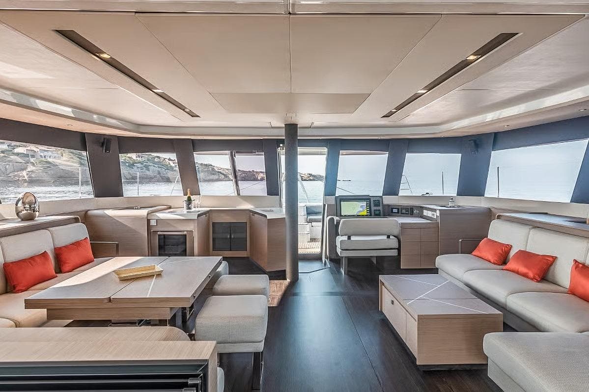 Luxurious interior of 2026 Fountaine Pajot Samana 59 yacht with modern furnishings and panoramic windows.
