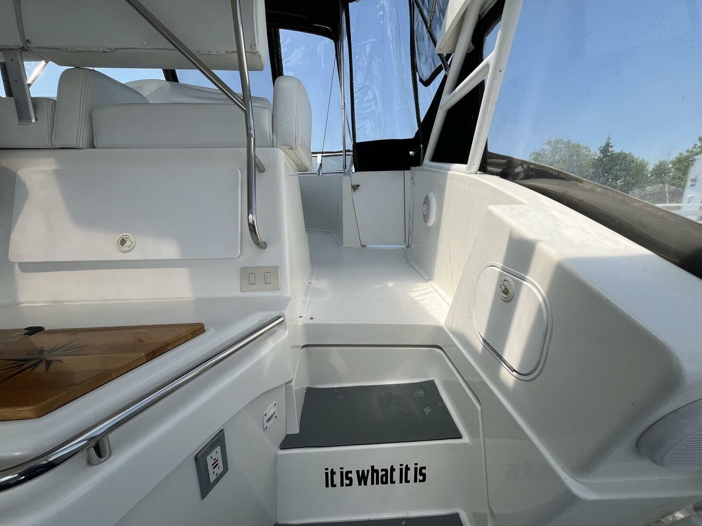 1996 Silverton 372 Signature yacht interior with white seating and "it is what it is" text.