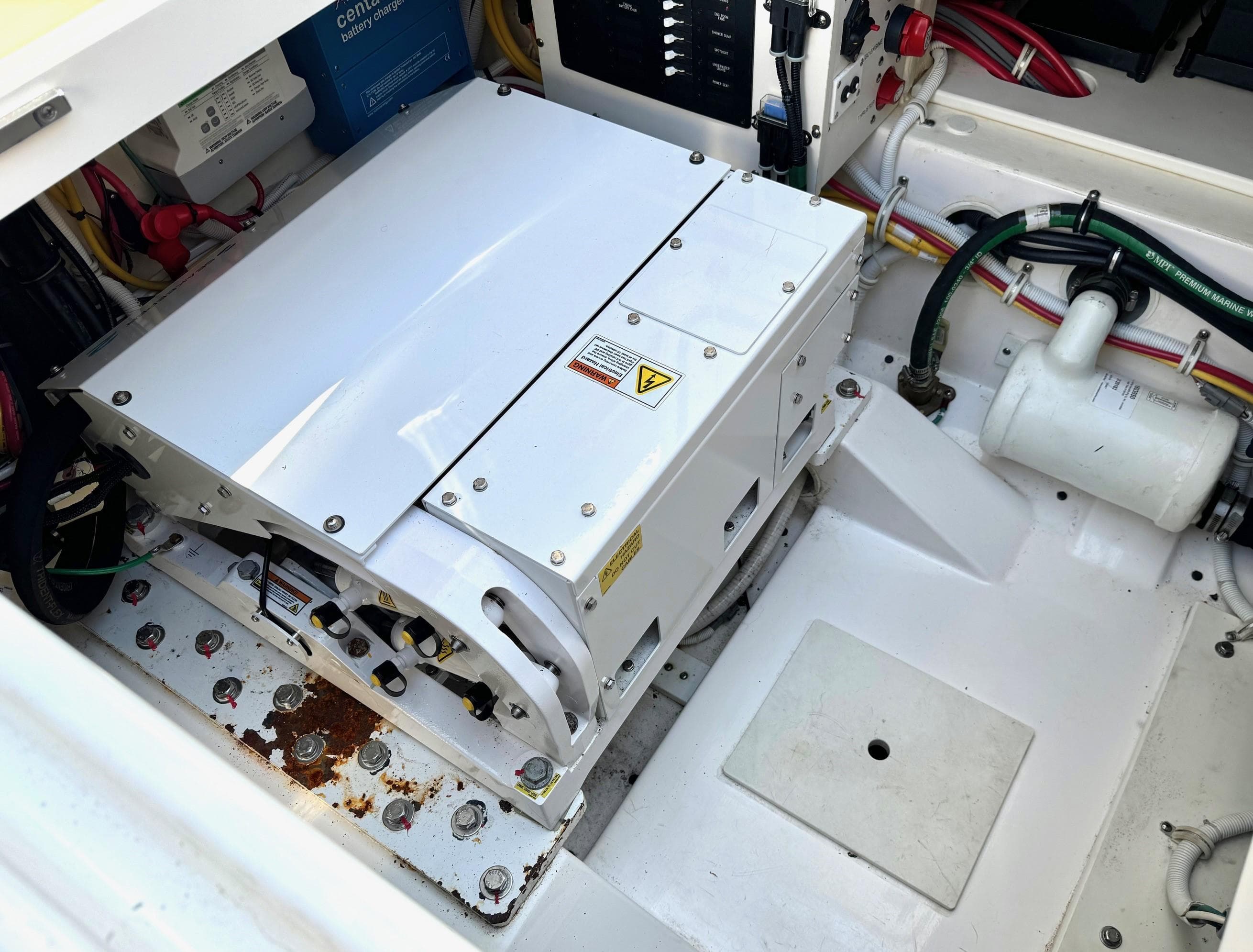 Engine compartment of 2020 Tiara Sport 34 LS boat, showing generator and wiring.