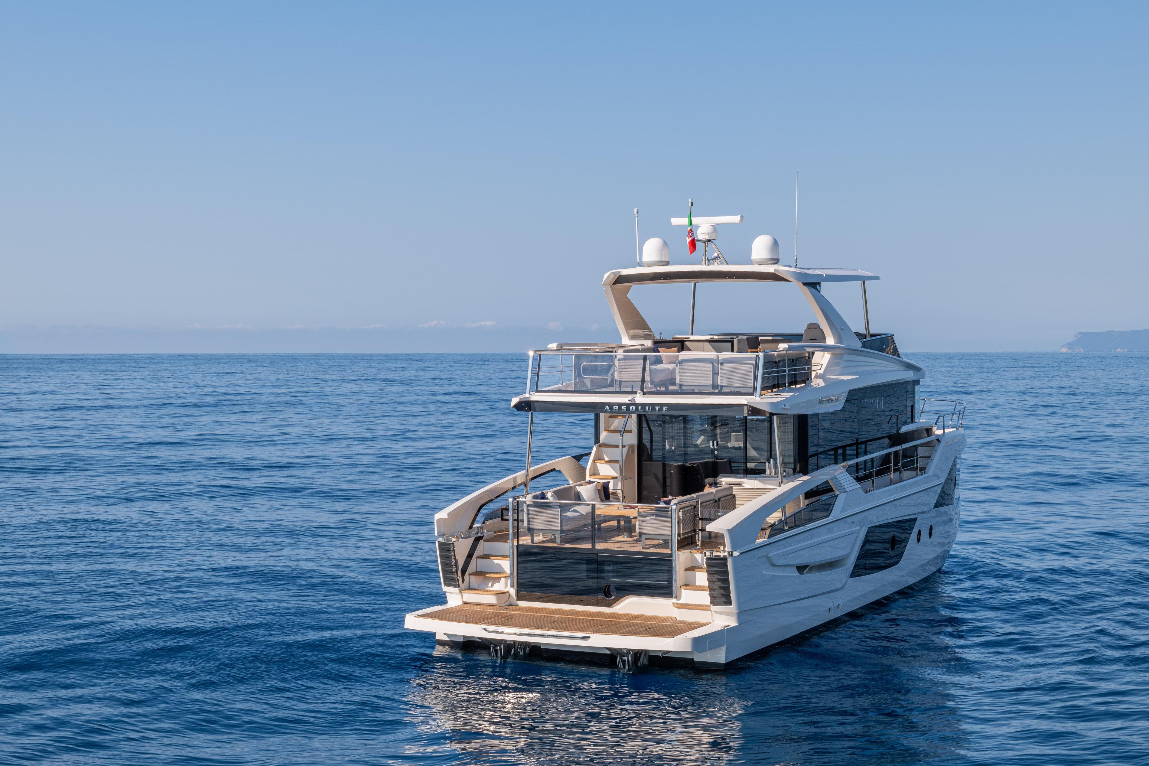 Luxurious 2026 Absolute 62' Navetta yacht cruising on calm blue ocean waters.