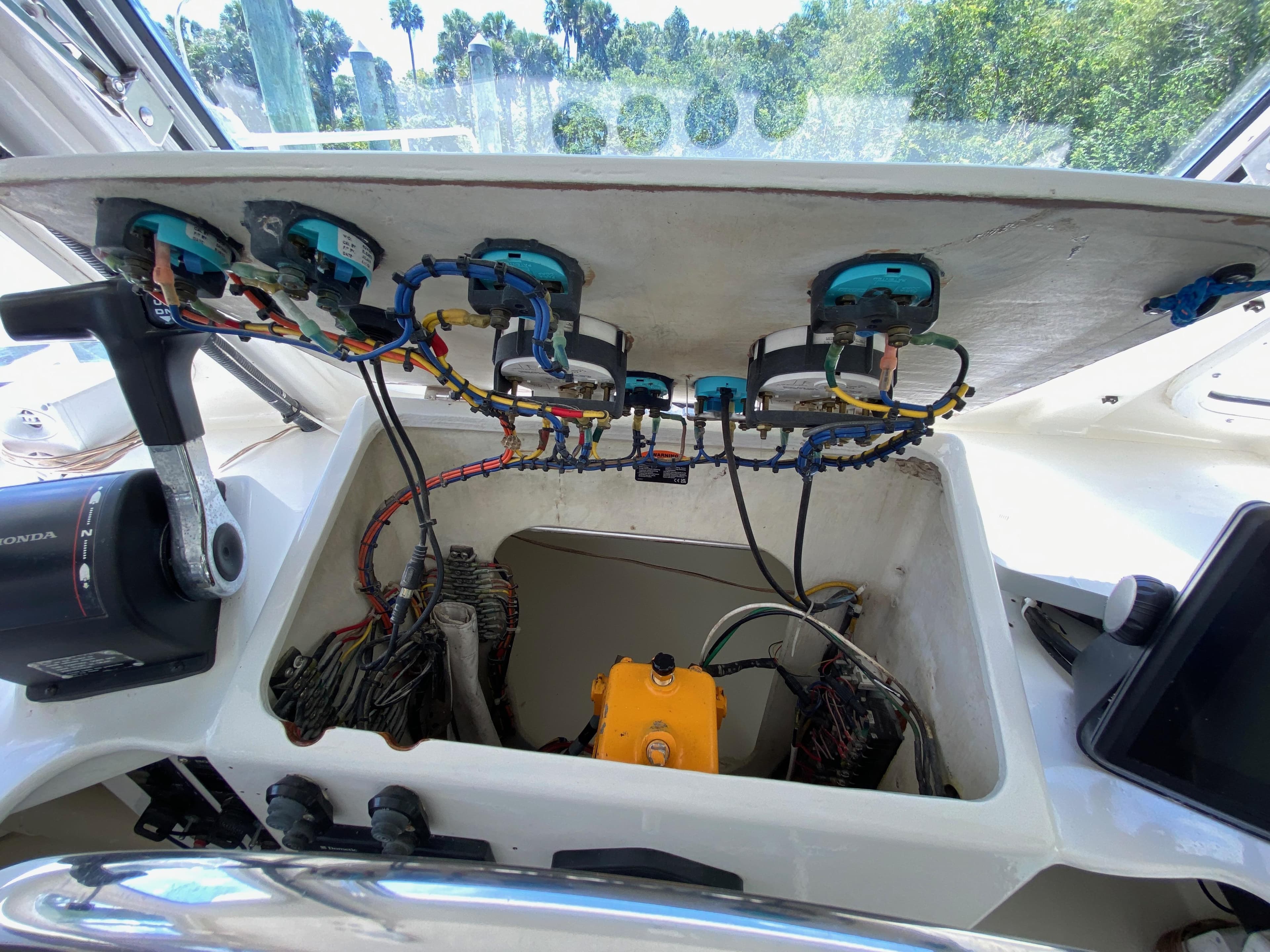 Boat dashboard wiring and controls, Custom model 62, 1996, with visible cables and components.