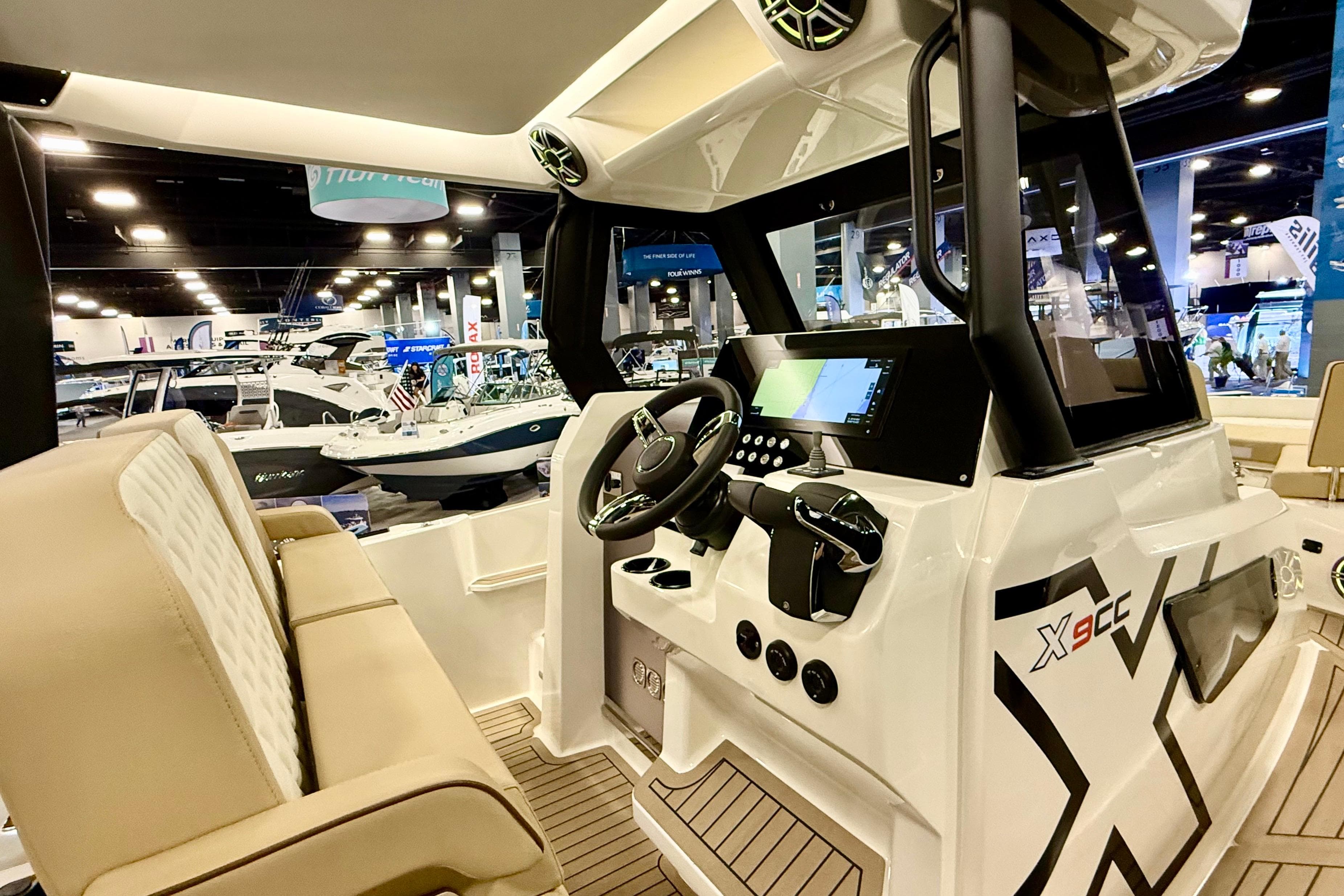 Interior view of 2026 Zodiac X9CC boat with modern dashboard and seating.