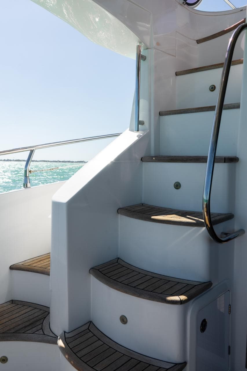 Staircase on 2014 Azimut 45 Flybridge yacht with ocean view.