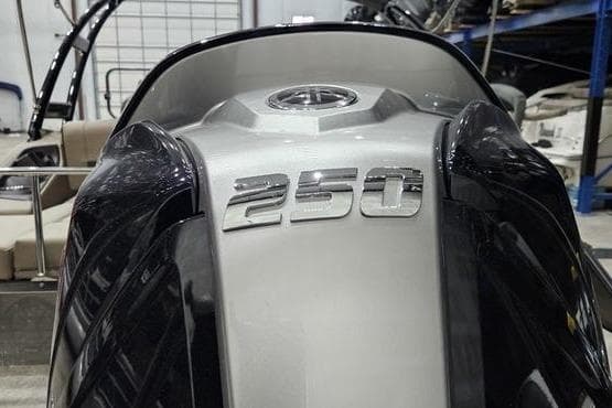 2026 Bennington 24 LSBA boat with "250" emblem, sleek design in a showroom.