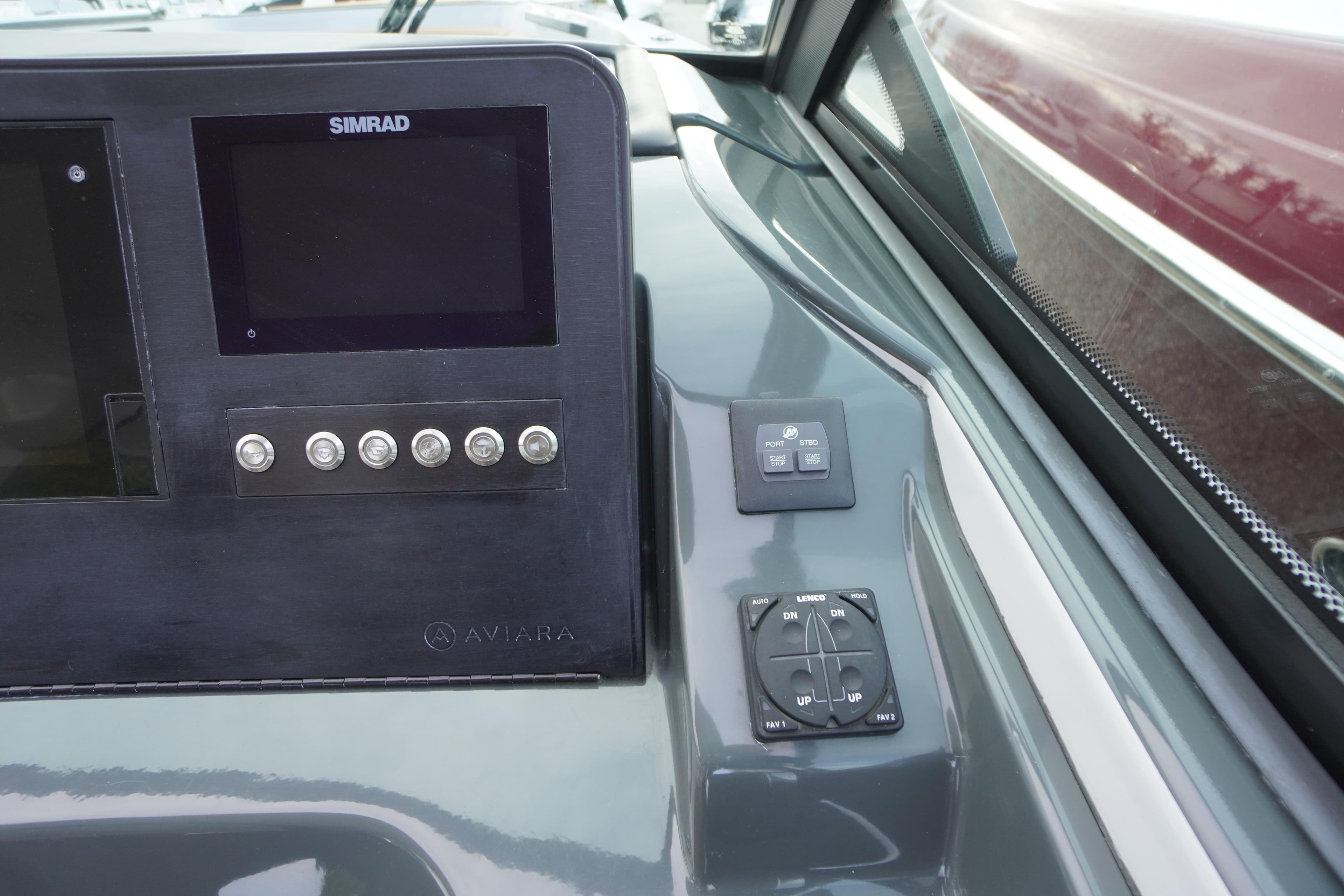 2020 Aviara AV32 OB dashboard with Simrad display and control panel.