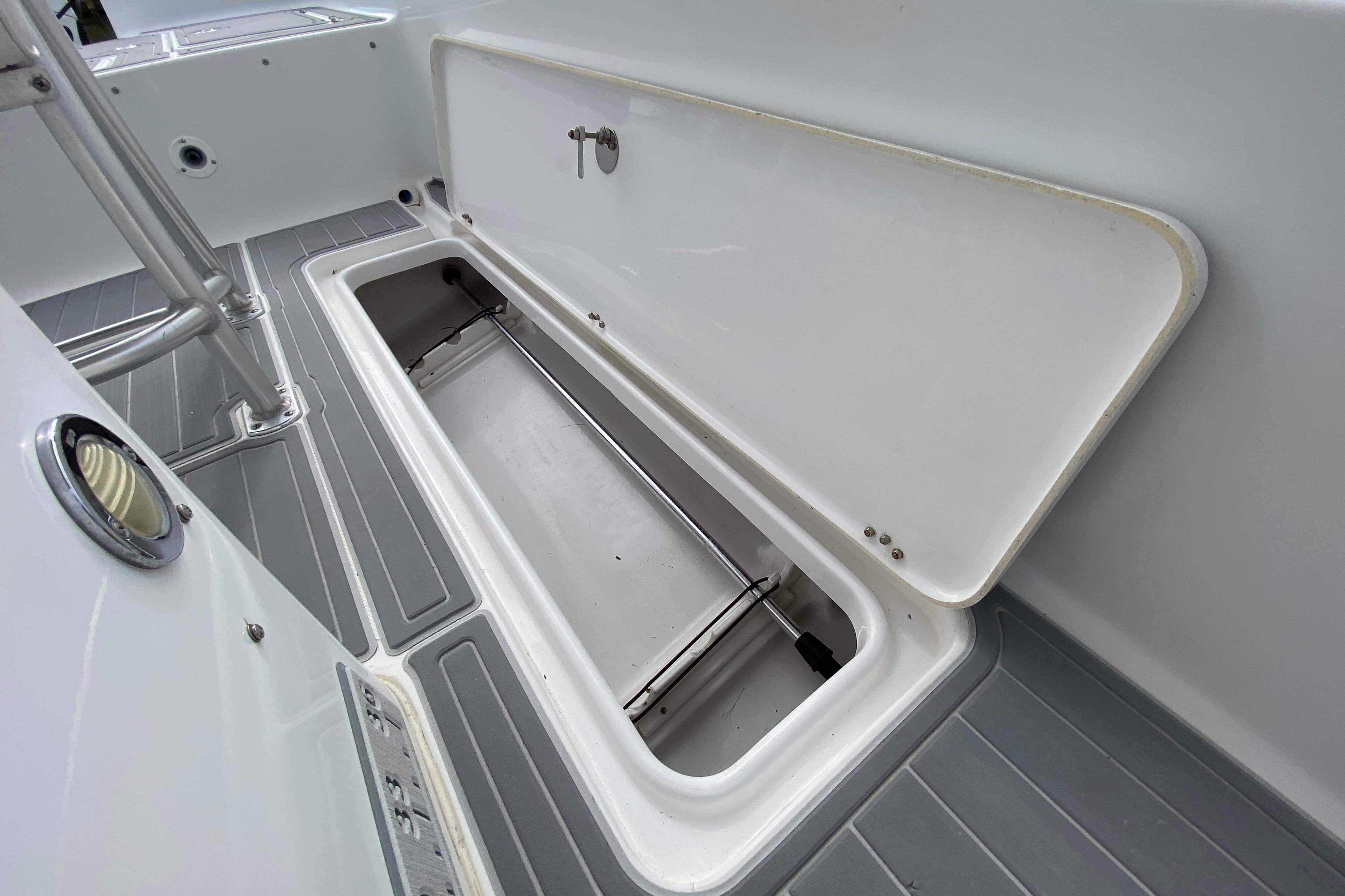 Open storage compartment on 2004 Palmetto 22 Excursion boat deck.