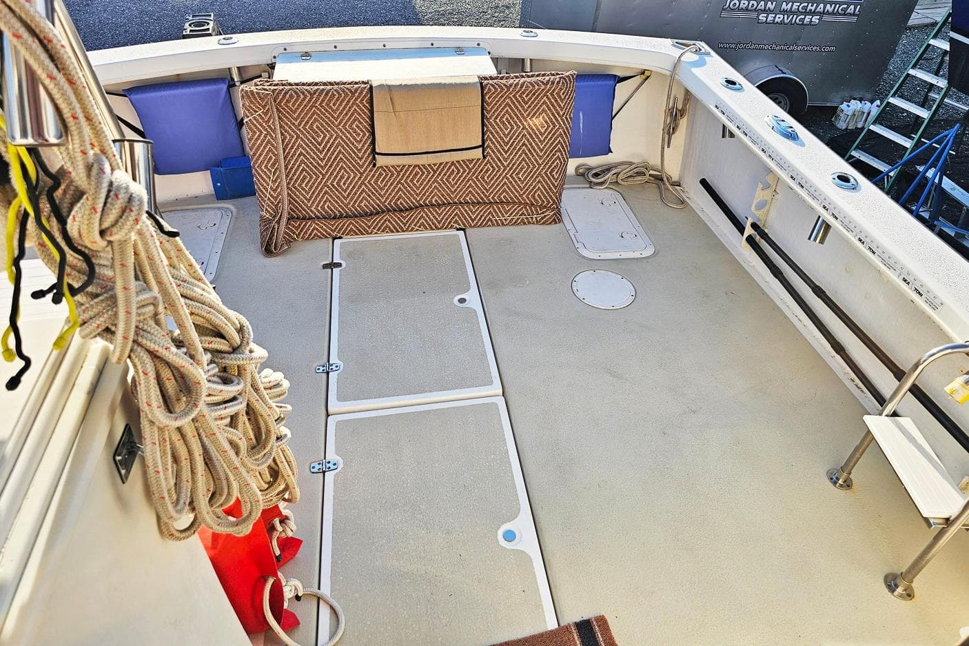 Spacious deck of 2010 Eastern Casco Bay 35 boat with ropes and seating.