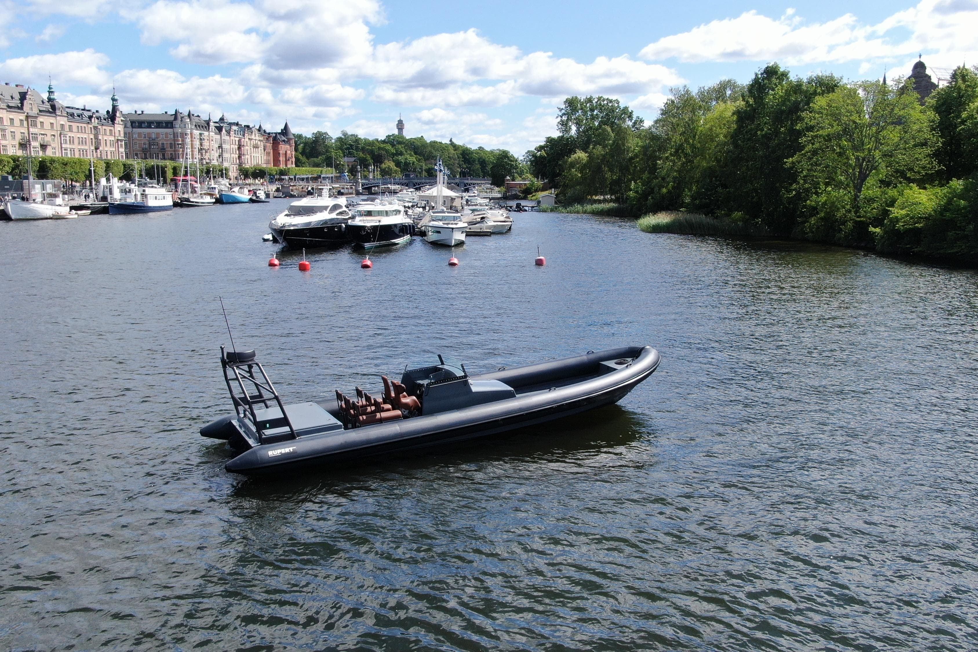 Rupert 40 boat from 2000 on a scenic river with moored yachts.
