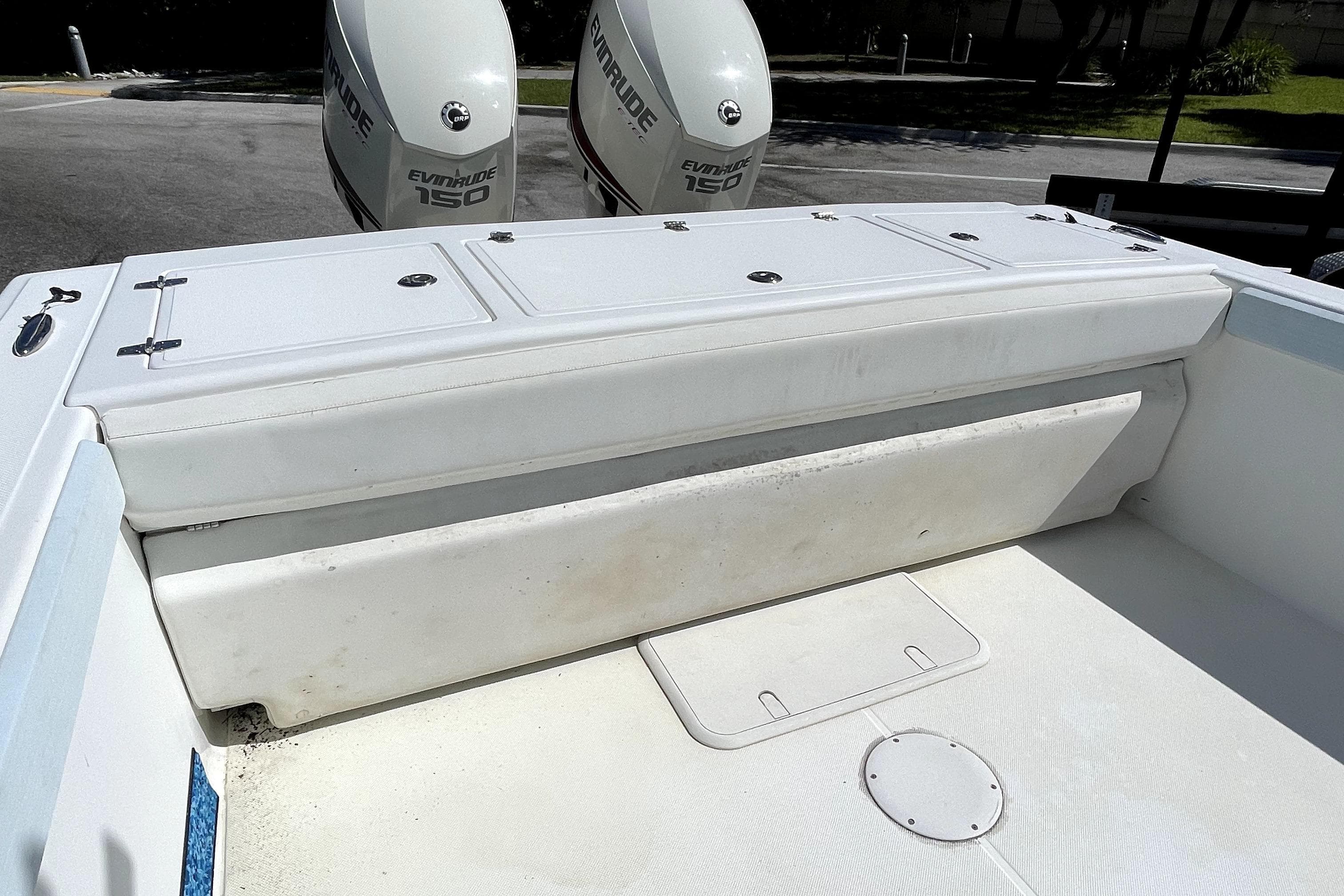 2013 Ocean Master 27 Center Console boat with Evinrude 150 engines, rear seating view.