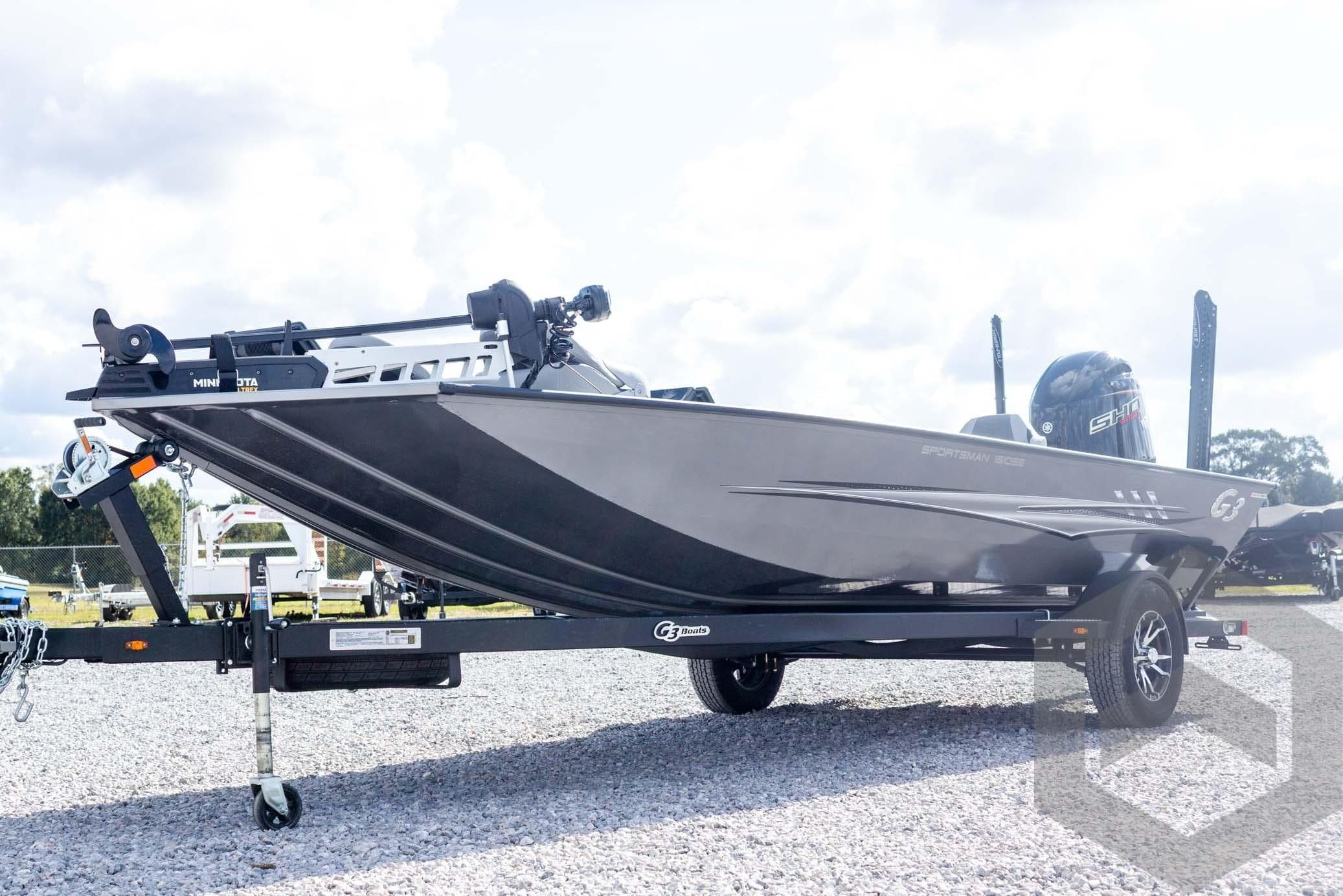 2026 G3 Sportsman 1910 SE boat on trailer, parked outdoors on gravel.