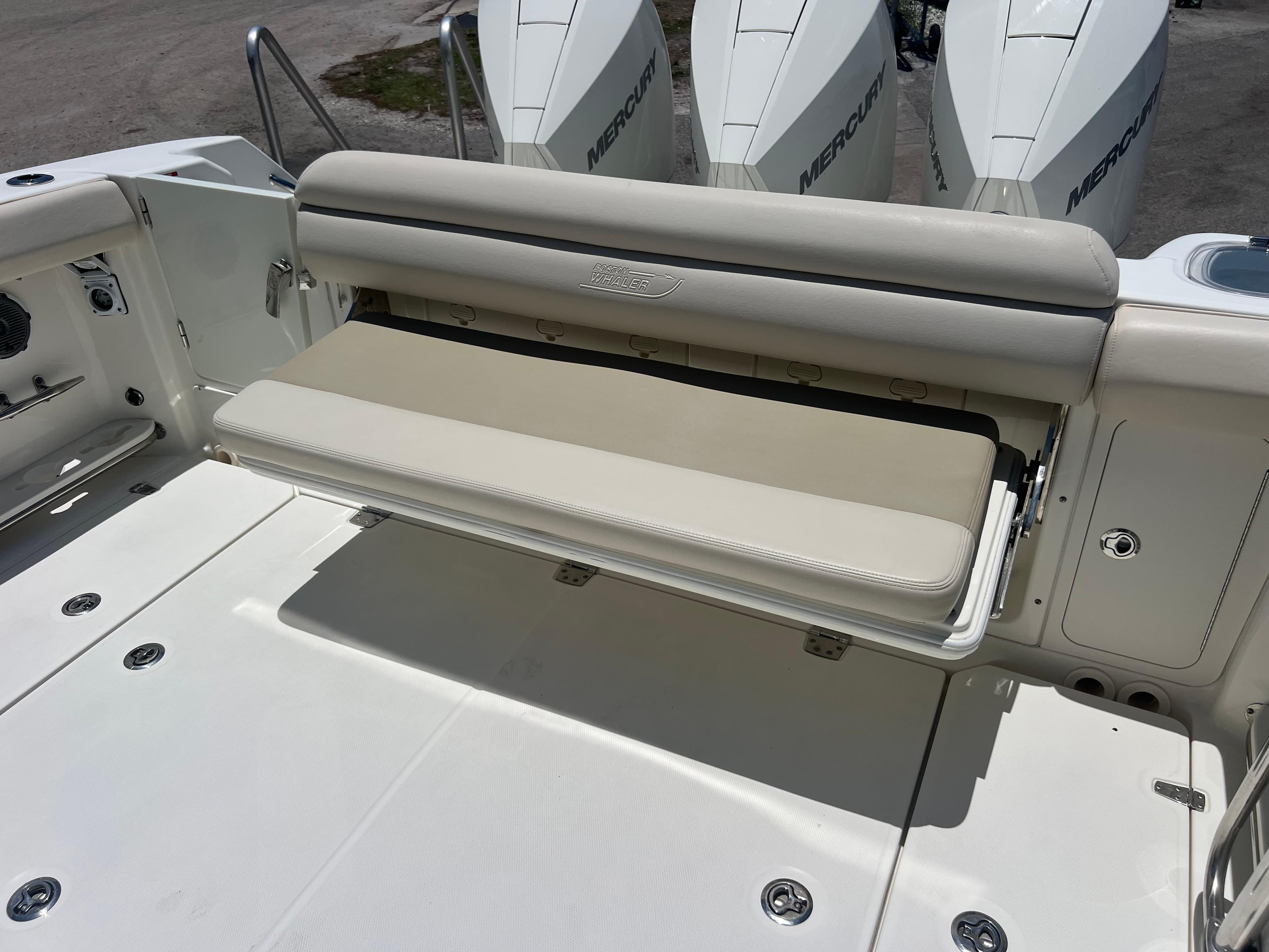 2017 Boston Whaler 350 Outrage boat with foldable seating and Mercury engines.