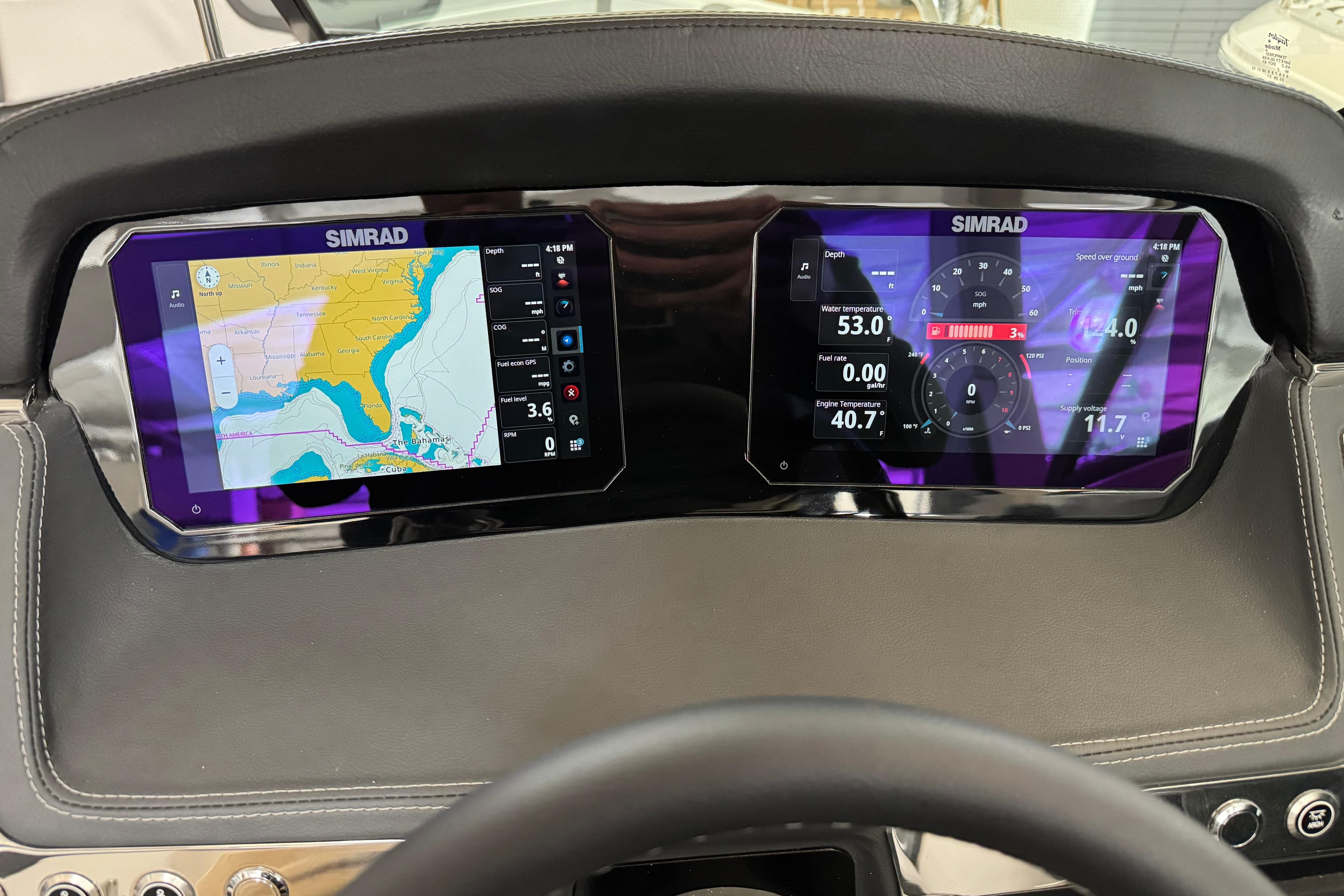 Dashboard of 2026 Chaparral 270 OSX with dual Simrad displays showing navigation and engine data.