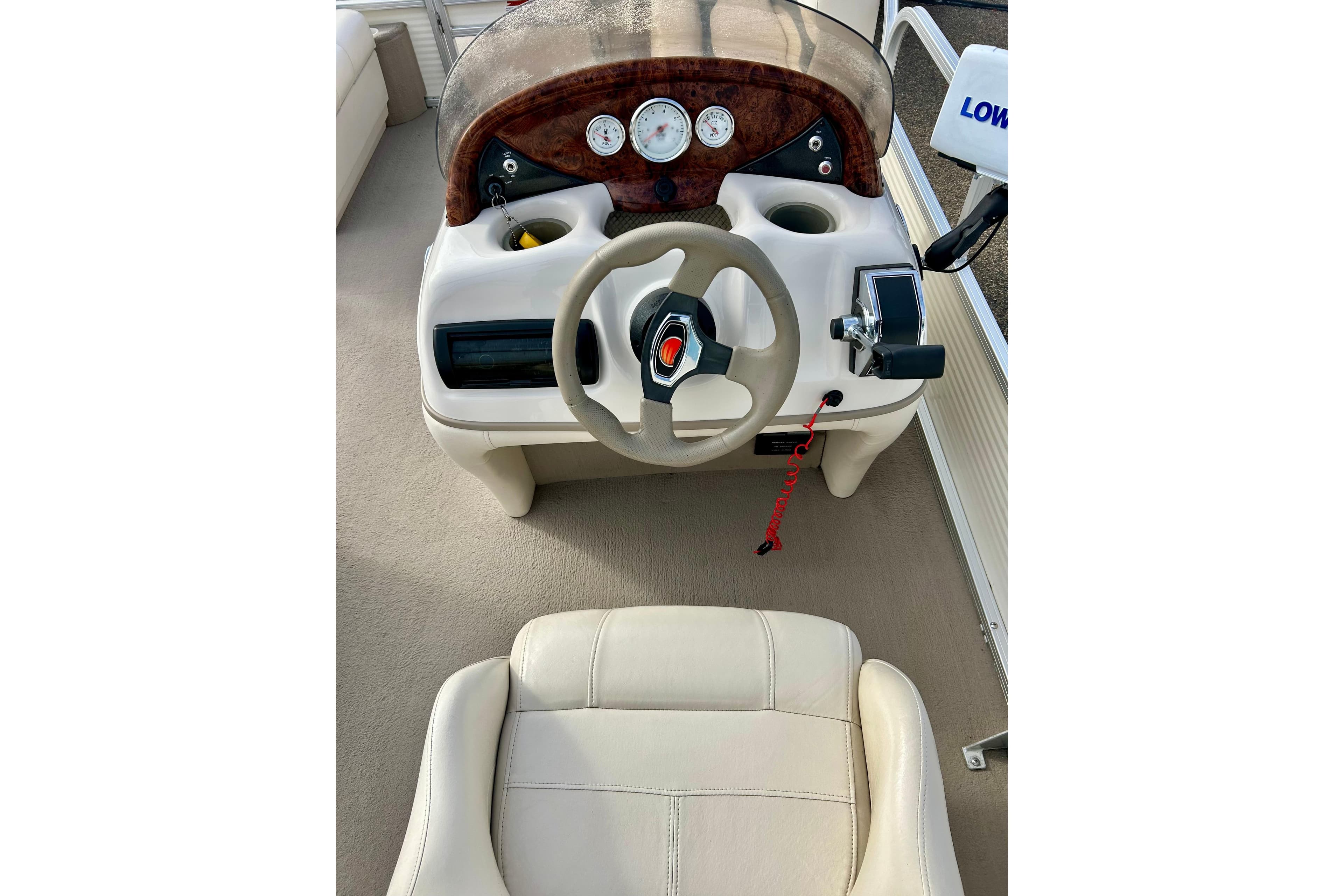 2010 Sun Tracker Party Barge 20 Classic Series boat dashboard and steering wheel.