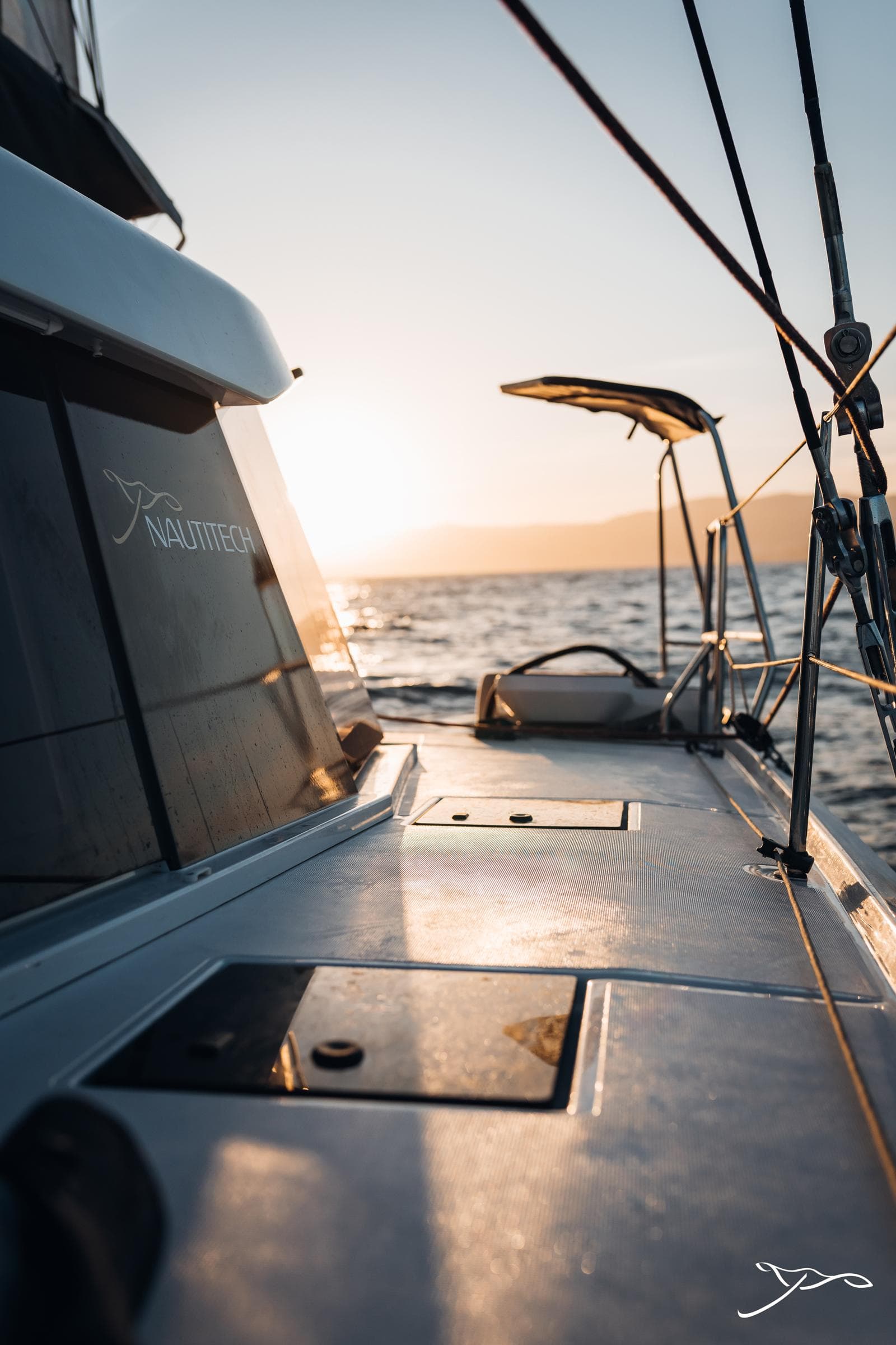 2025 Nautitech 44 Open sailing at sunset, showcasing sleek deck design and ocean view.